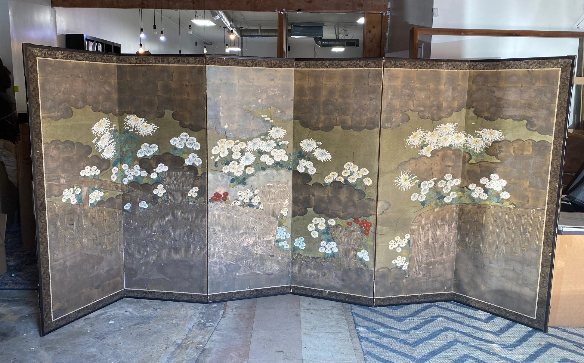 A gorgeous six-panel Japanese Byobu folding screen depicting a floral landscape scene from the perspective of looking over a home veranda. The rich colors, gold leaf, and beautiful hand-painted detail really make this an attractive and special work.