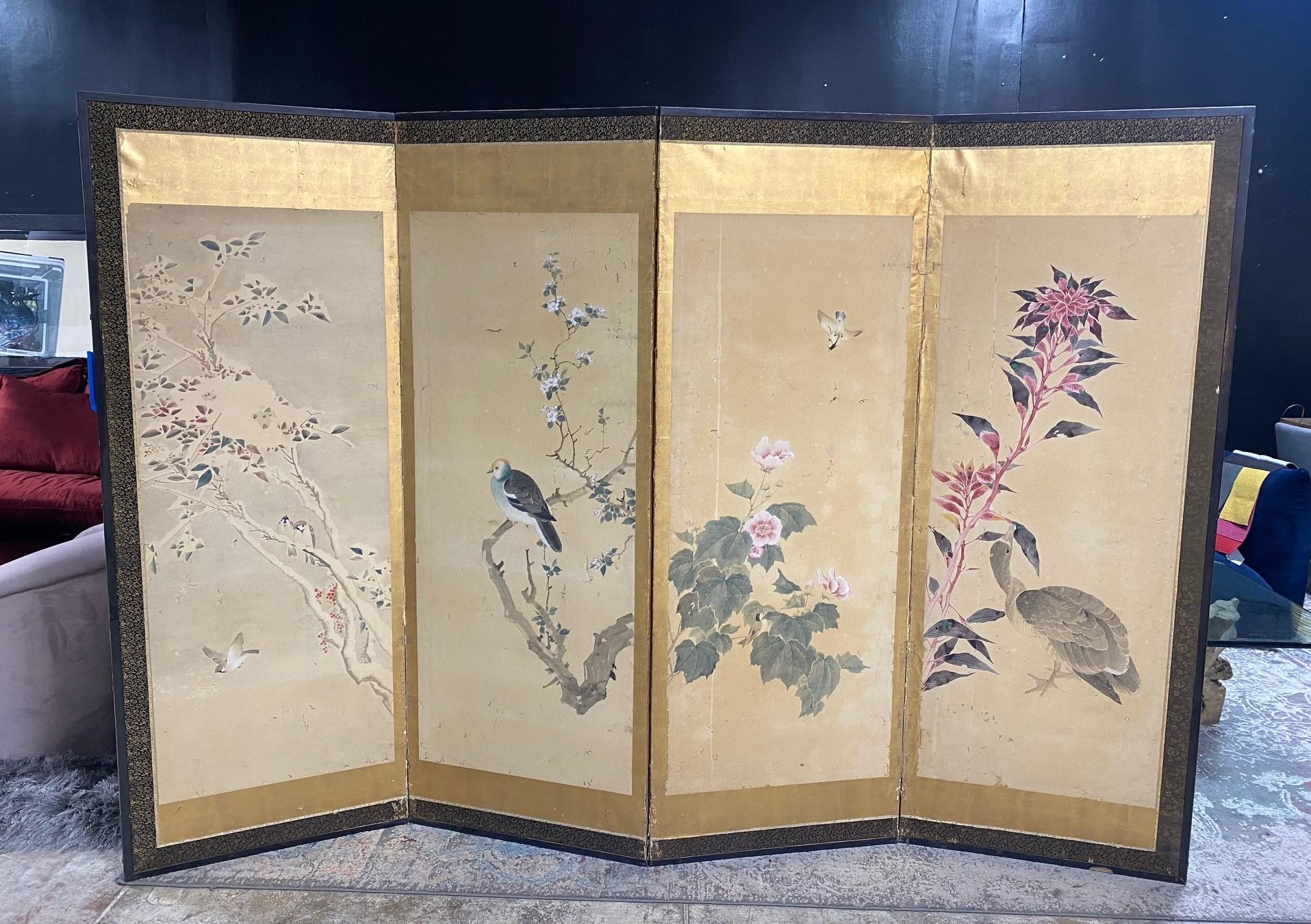 A gorgeous hand-painted four-panel Japanese Byobu folding screen depicting various nature/landscape scenes with an array of bird species and blossoming flowers.  The rich colors, gold leaf, complex design/composition, and beautiful hand-painted