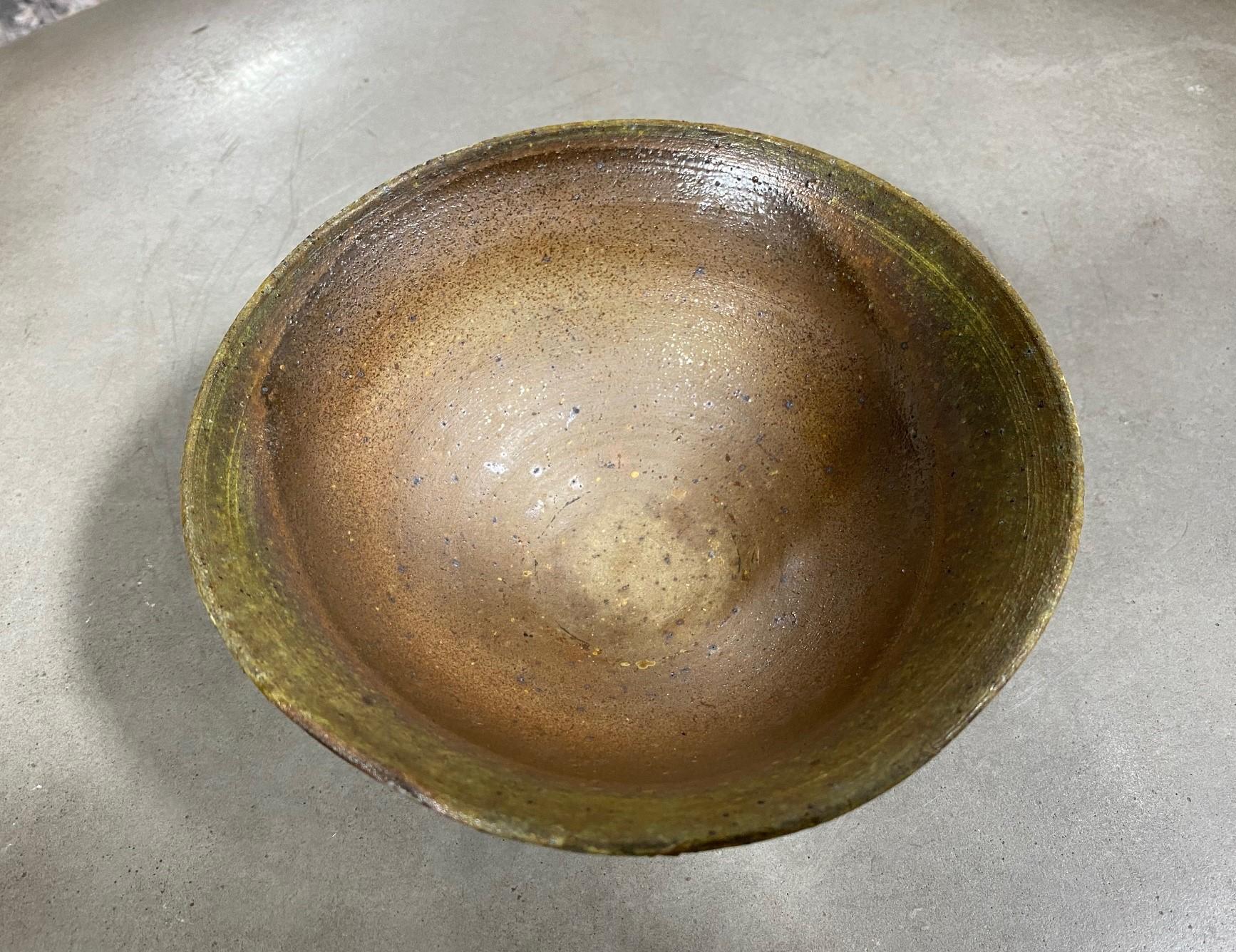 A wonderful and well crafted Japanese artisan bizen ware chawan tea bowl. Beautifully fired and colored. 

Japanese Bizen-Yaki pottery which dates back hundreds of years (its heyday was in the 16th century) is recognizable by its rustic quality