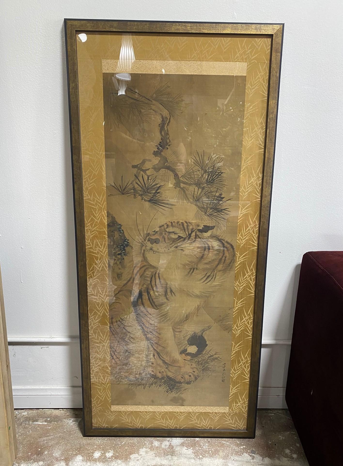 A beautiful and striking Japanese Edo period tiger scroll. Hand-painted with masterful brushstrokes on a silk surface. Wonderfully captured and composed with a hint of whimsy and mischief. 

We believe this could be the work of Saito Shuho