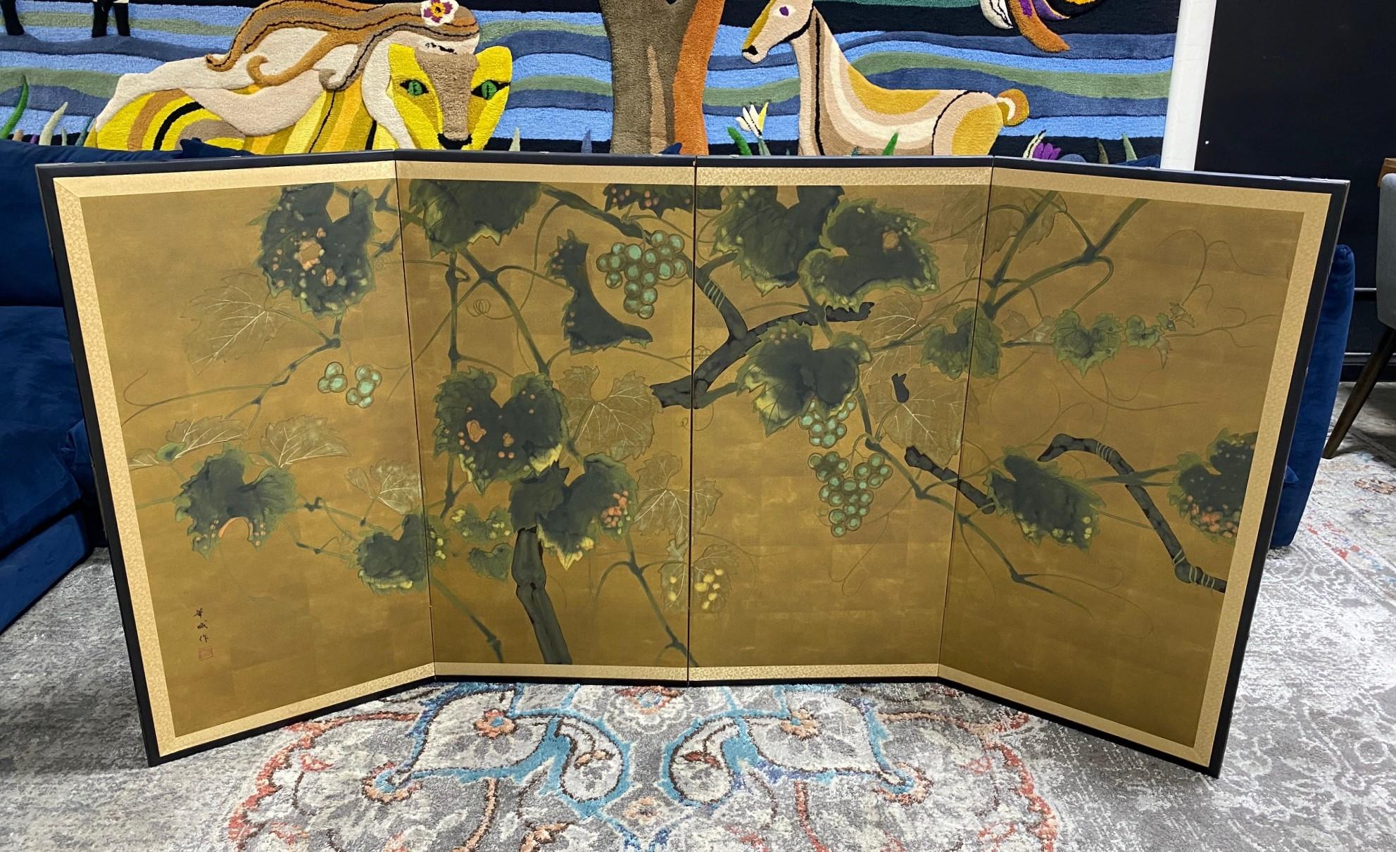 A truly gorgeous four-panel Japanese Byobu folding screen depicting a nature scene with a lotus tree in full bloom. The subtle yet rich colors, gold leaf, and beautiful hand-painted detail of the tree and hanging fruit make this an attractive and