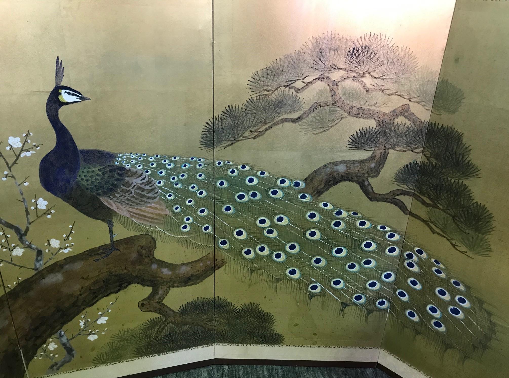 A truly beautiful four-panel Japanese Byobu folding screen depicting a majestic peacock with a tail of beautifully arrayed rich colors. The gold leaf and beautiful hand painted detail really make this an attractive and unique work.

Original