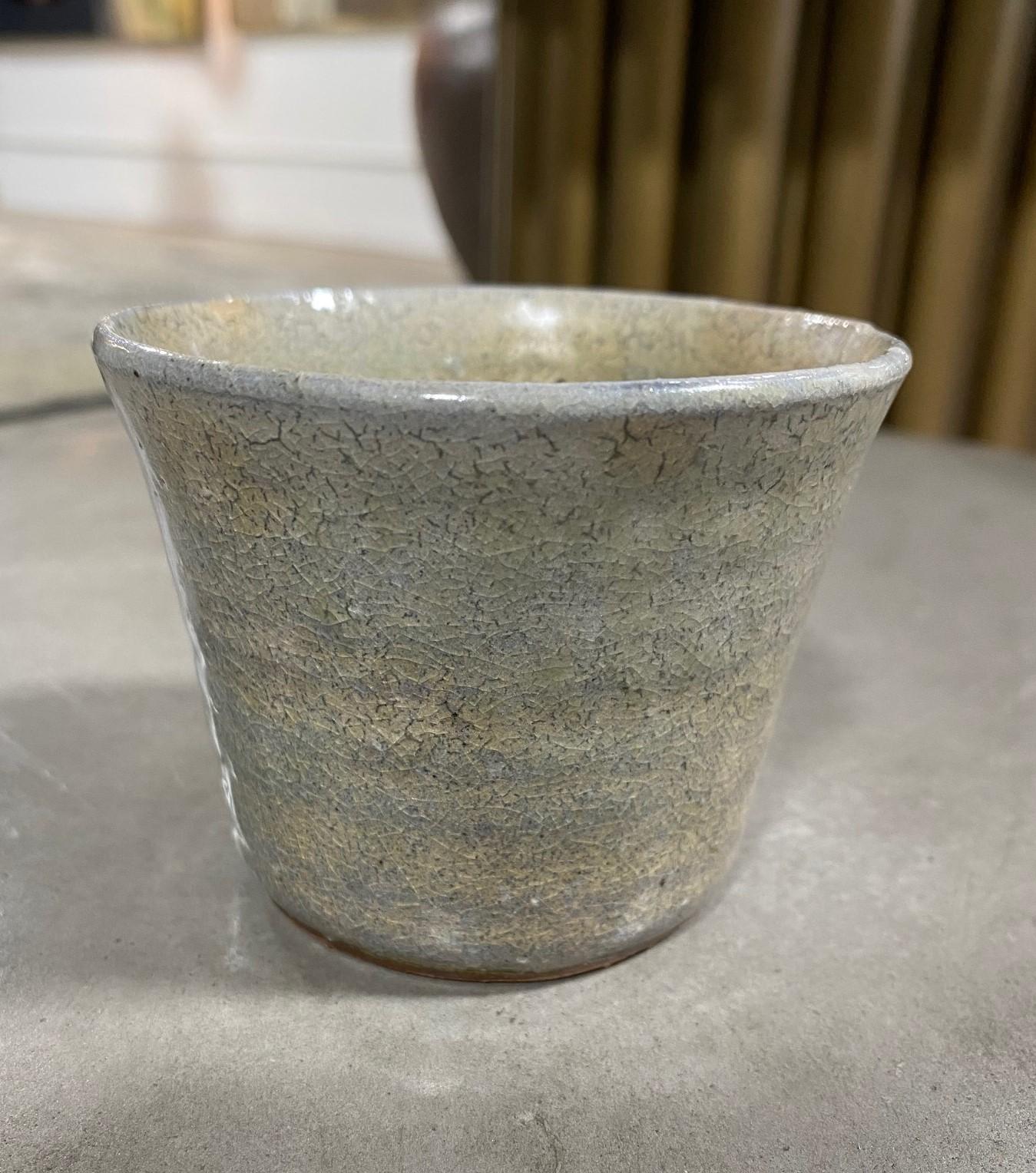 A beautiful Japanese yunomi teacup featuring a subtle blue-green crackle glaze. The work radiates in the light. 

This little gem (along with others we will be listing) came from a collector of fine Japanese and Asian ceramics - a collection like