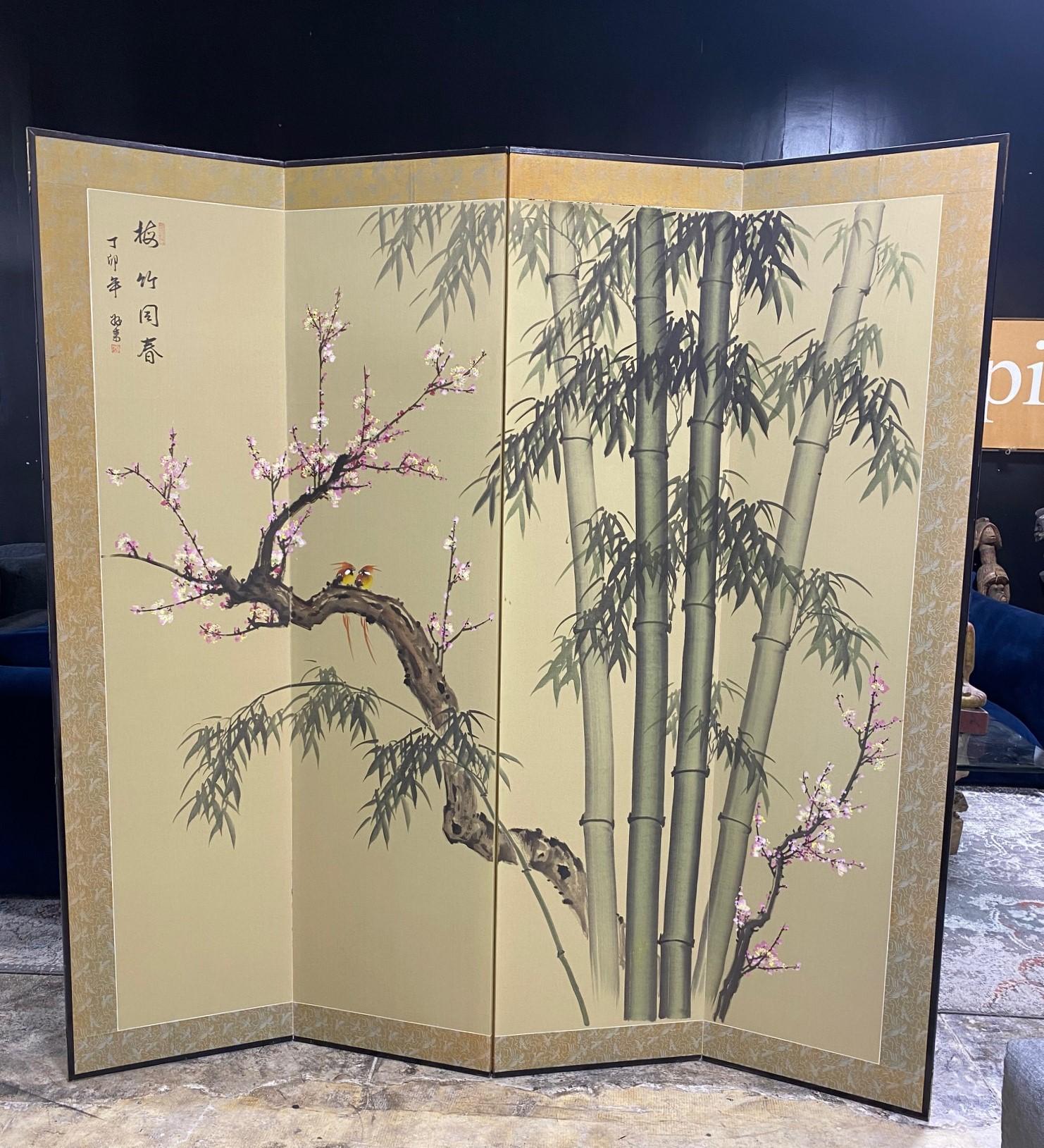 A gorgeous large/tall four-panel Japanese Byobu folding screen depicting a nature scene/landscape with playful yellow and orange birds frolicking in nature among the branches of a blossoming/blooming cherry tree and bamboo forest. The work is
