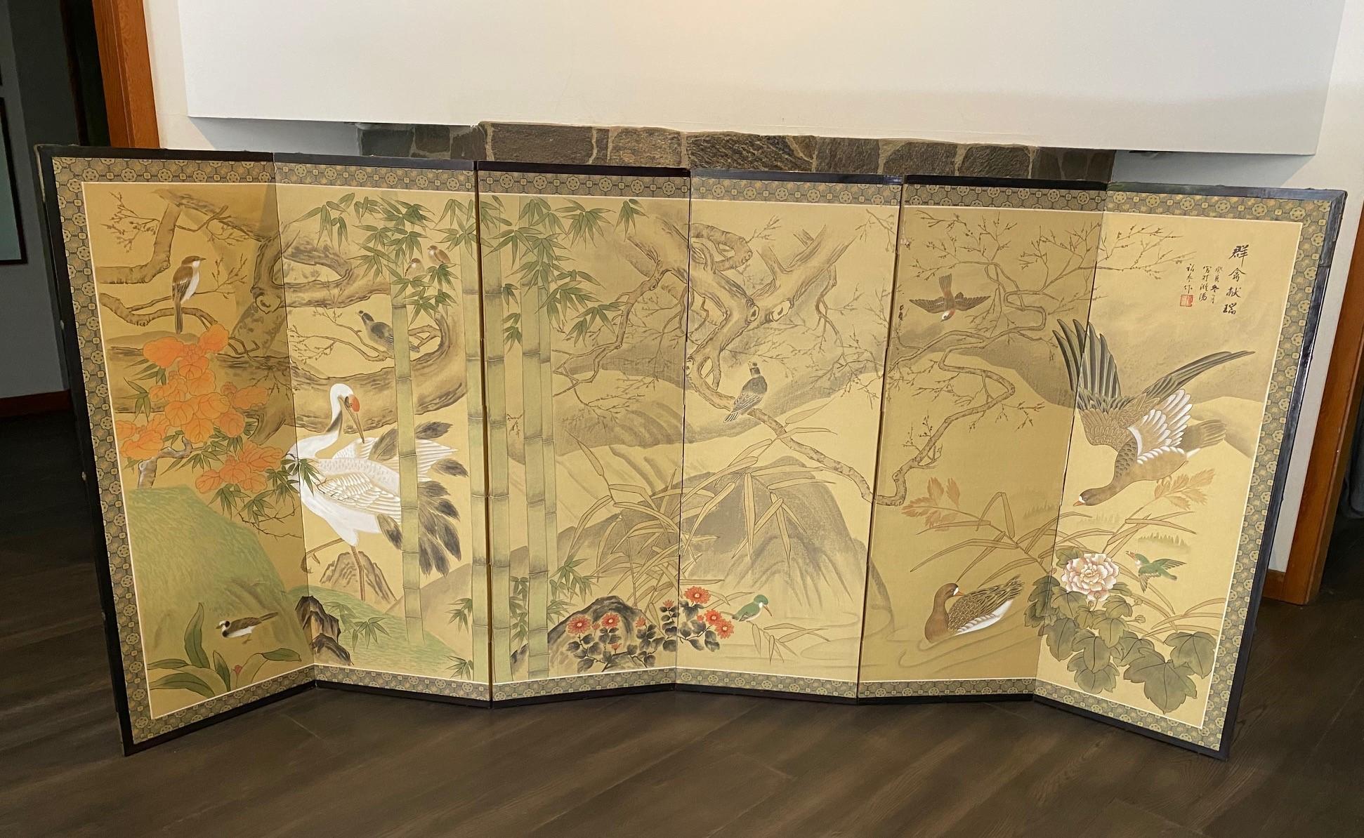 A gorgeous six-panel Japanese Byobu folding screen depicting various species of playful birds in a natural tree-filled landscape with surrounding ponds. The rich colors, complex composition, and beautiful hand painted detail really makes this an