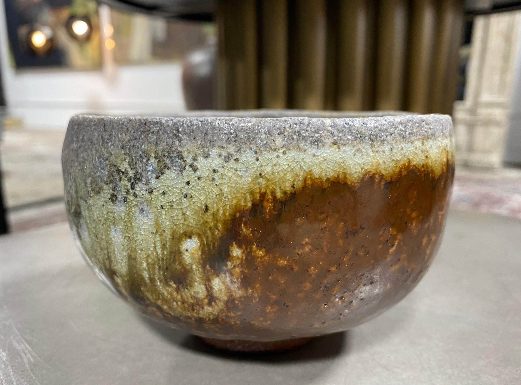 A stunning Japanese stoneware studio pottery chawan tea bowl that features a beautiful, heavy and sumptuously multi-glaze with wonderful shifts in color and texture. This bowl is without question one of our personal favorites.

This particular