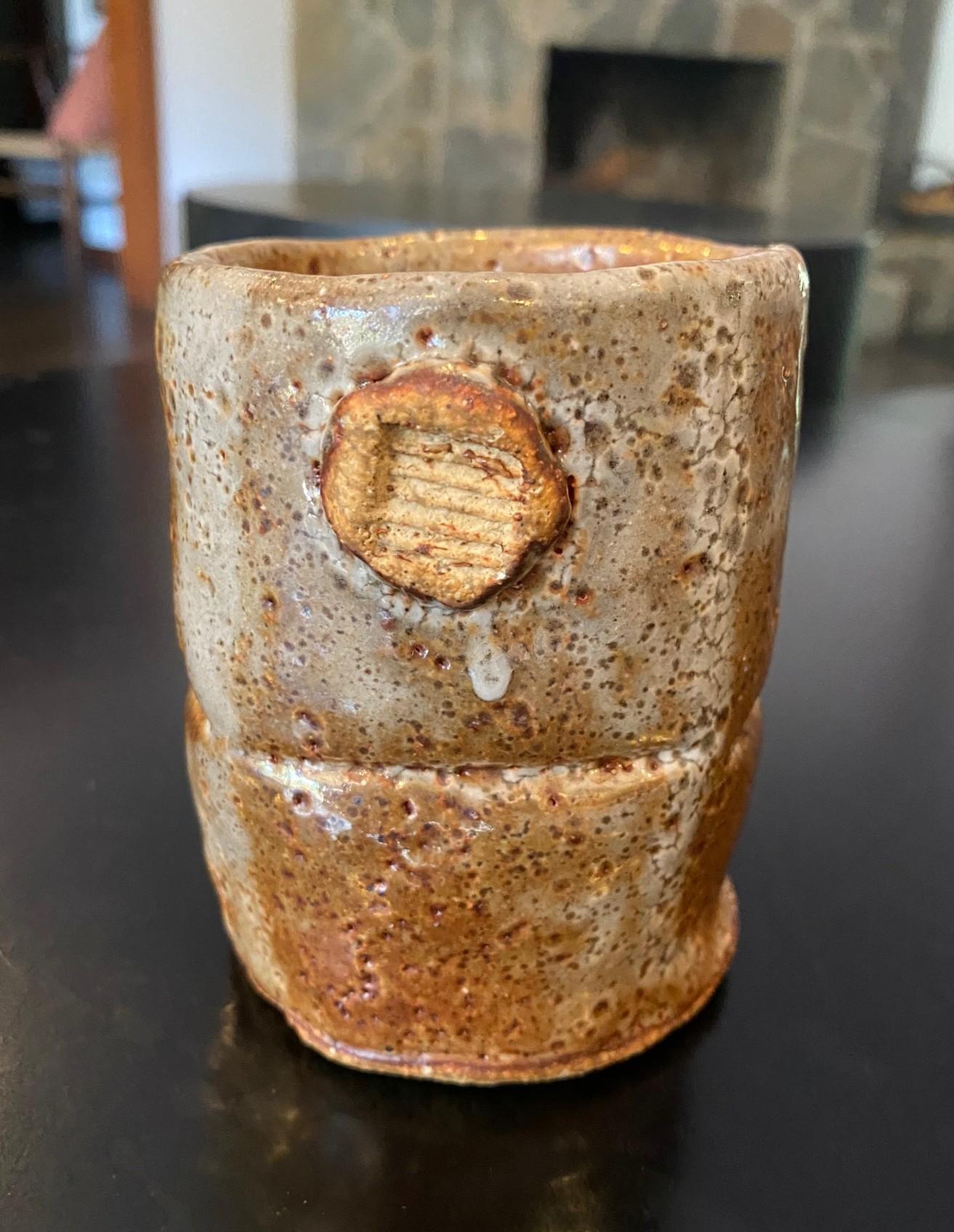 A gorgeous Japanese studio pottery Chawan tea cup that features a mix of shifting colors, glazes and textures as well as elements of Shino Ware and Hagi Ware.  The piece radiates in the light.  

This particular piece also encompasses the Japanese