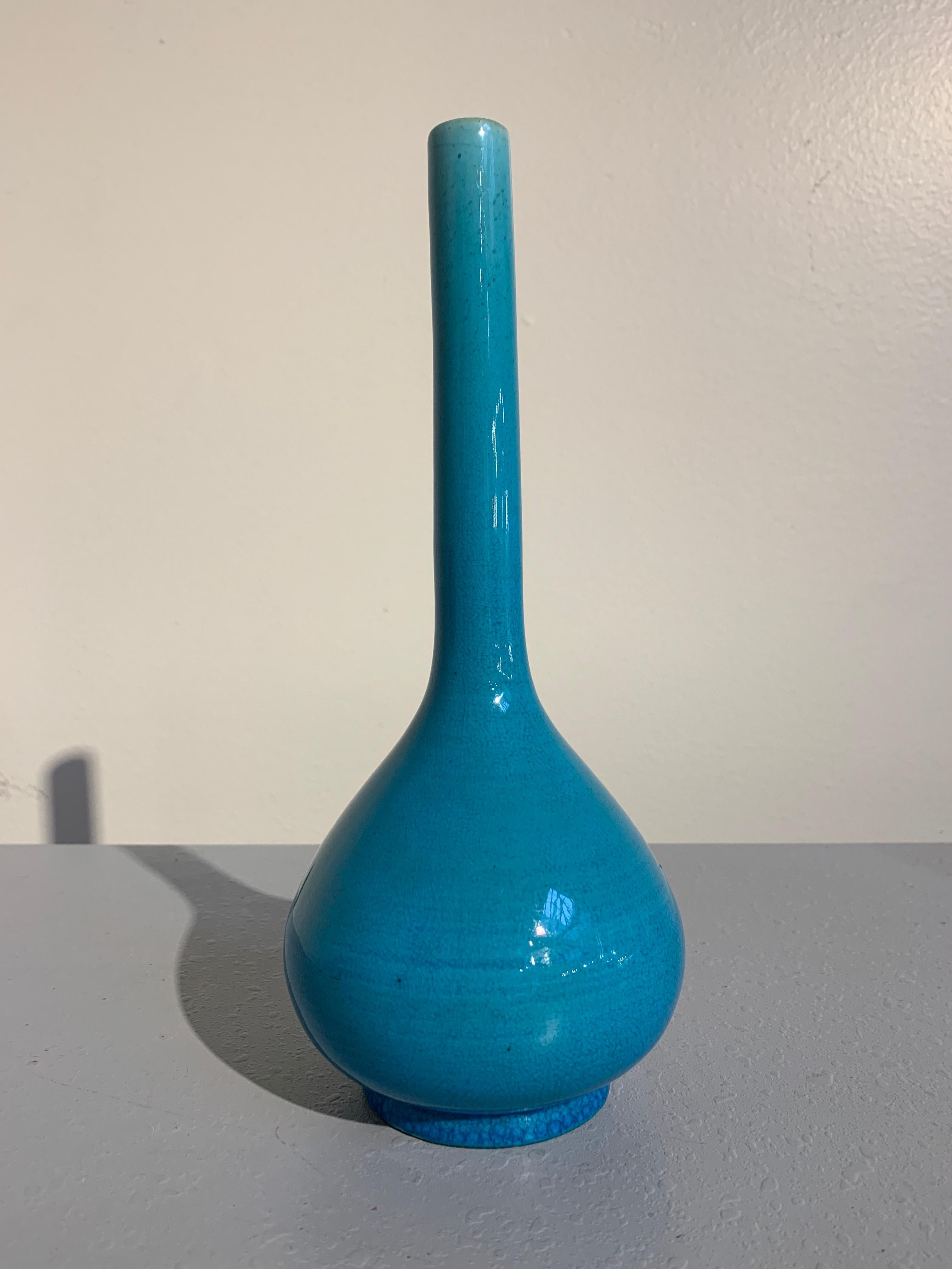 A fine and attractive monochrome turquoise glazed stick neck vase, Awaji Pottery, Meiji Period, Japan, circa 1900. 

The long neck vase beautifully potted and covered in a striking monochrome turquoise or peacock blue glaze. The pear shaped body