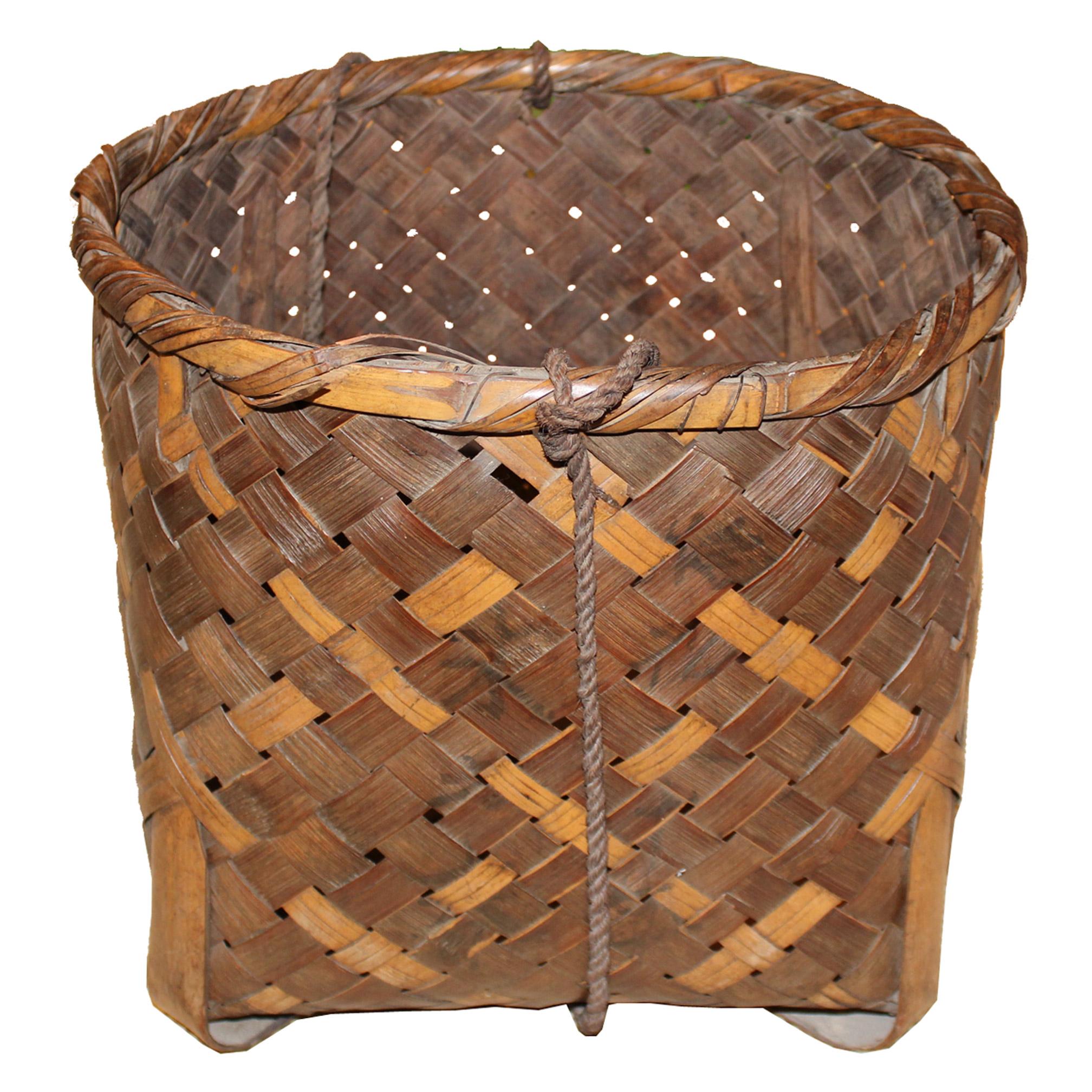 Handwoven Japanese bamboo basket with rope originally used by farmers in northern Japan to harvest and transport vegetables. Use as a storage container, roll towels and store in the bathroom or use in the children’s room to store toys. Taisho