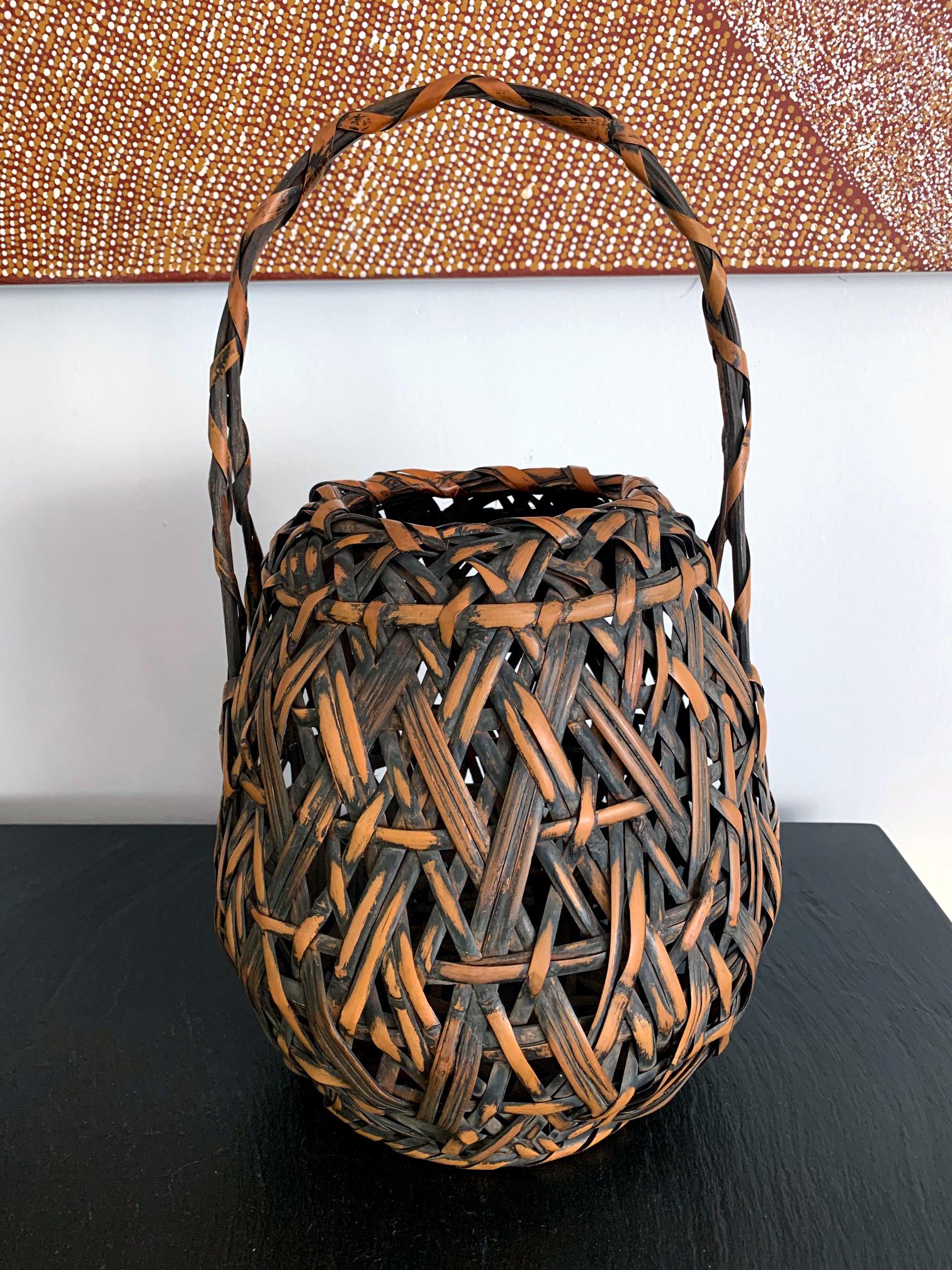 A Japanese bamboo Ikebana basket by Iizuka Hochiku (1883-?; active approximately 1900s-1940s). Hochiku was born in Tochigi Prefecture Kanto region and active in Tokyo. He was the third son of Iizuka Hosai I (1851-1916) and studied under him.
This