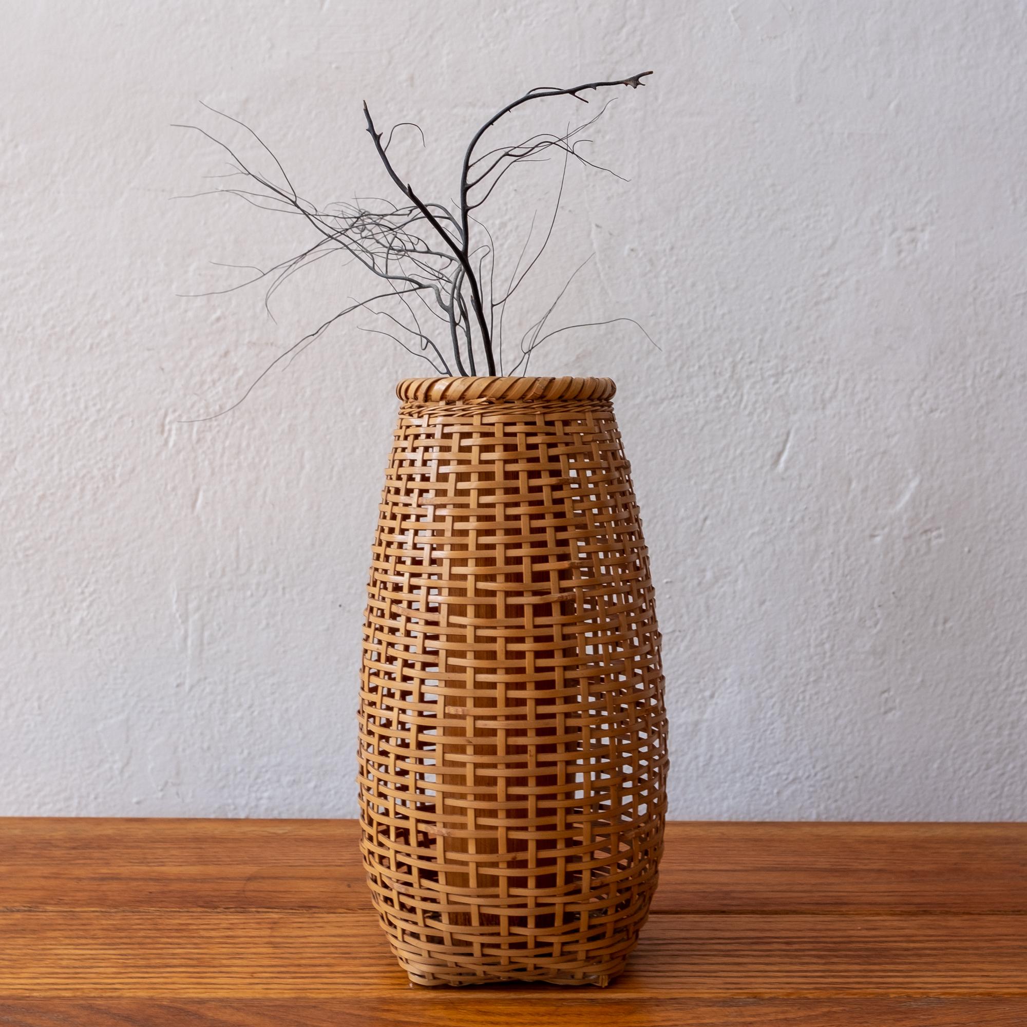 Japanese woven bamboo Ikebana basket from the Showa era. The interior bamboo stock provides a lovely silhouette.