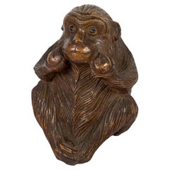 Japanese bamboo sculpture of a Monkey holding Longevity Peaches in its two hands