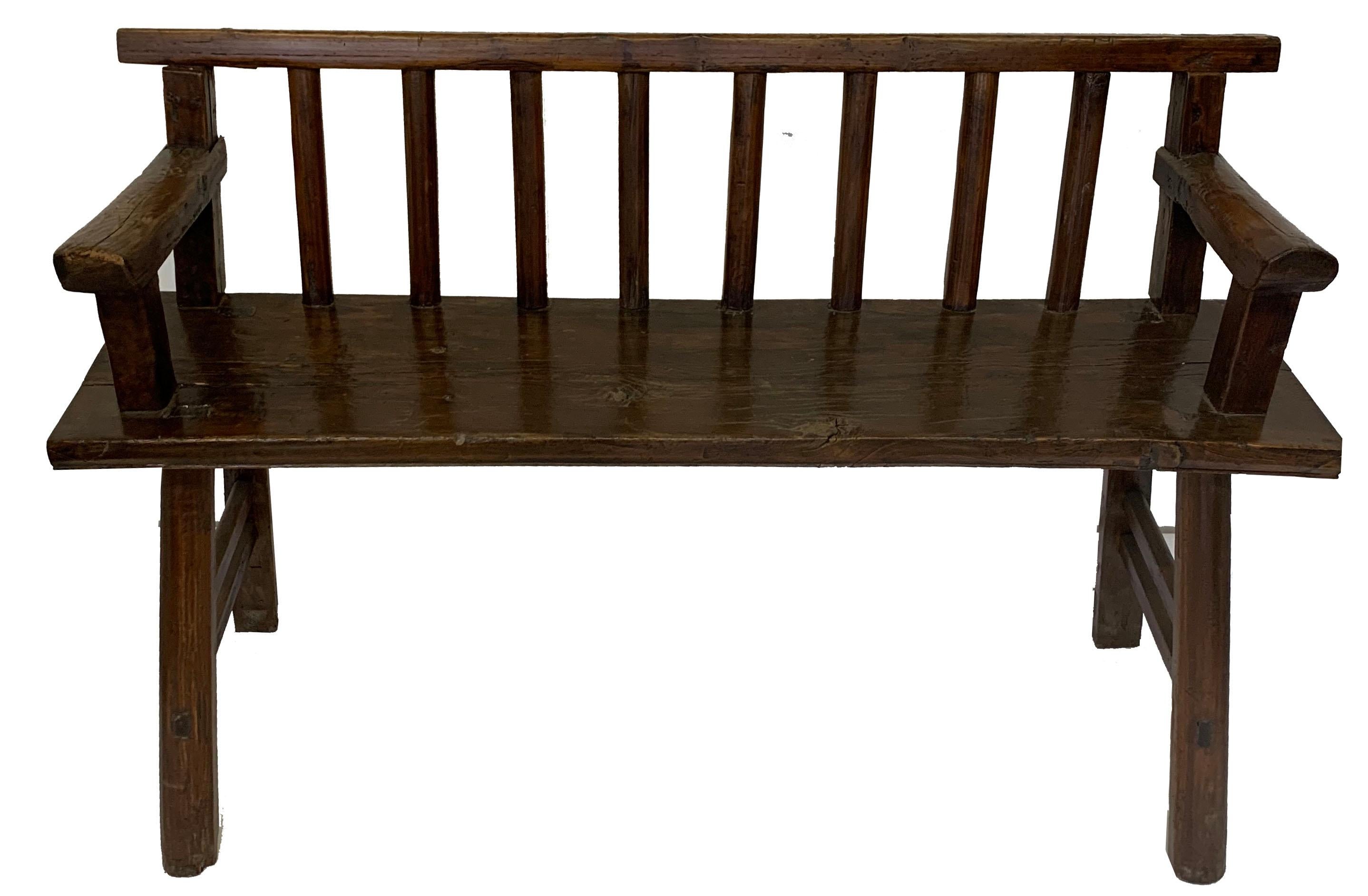 Japanese bench made out of solid wood. The bench has a higher seat which makes it perfect for an entry. 

Property from esteemed interior designer Juan Montoya. Juan Montoya is one of the most acclaimed and prolific interior designers in the world