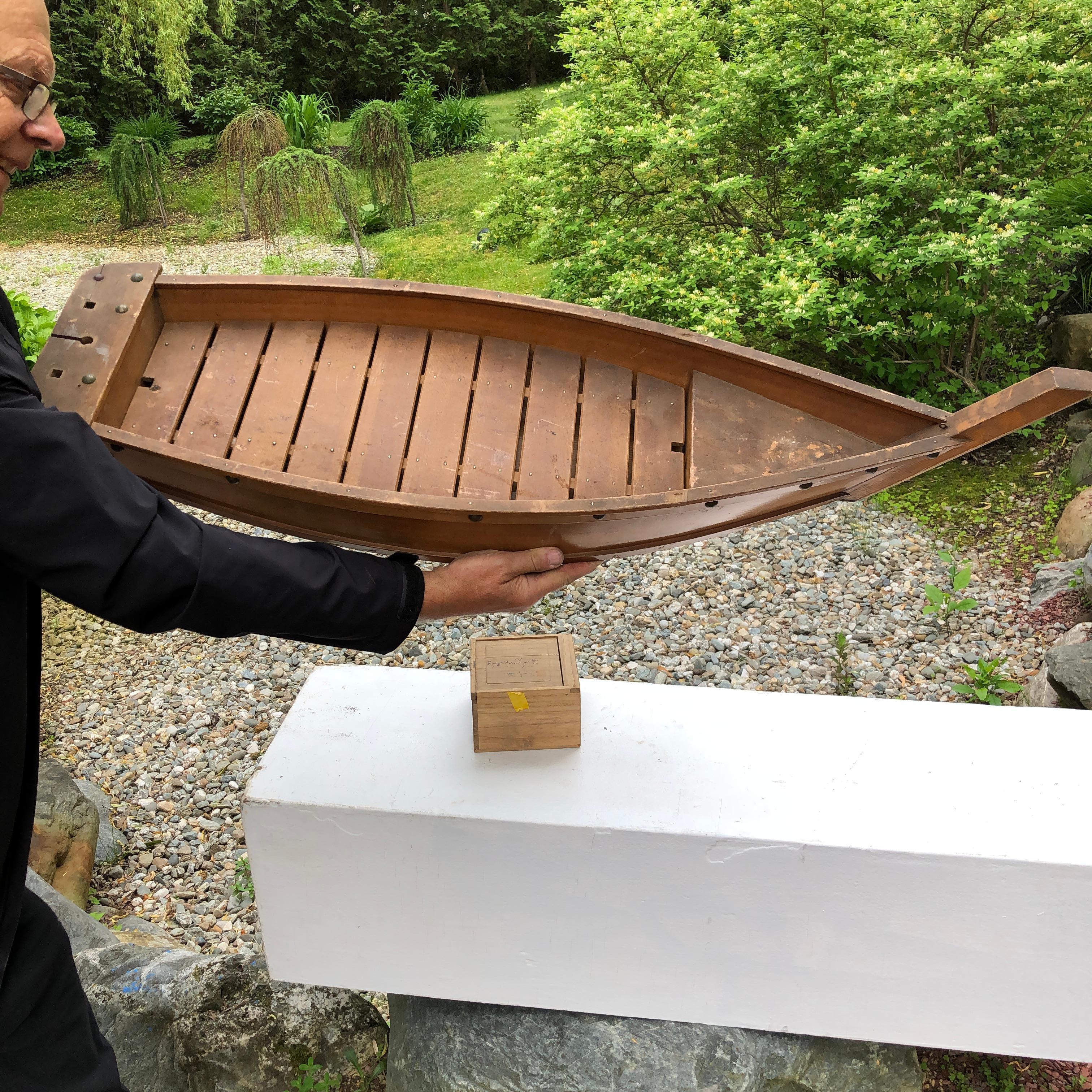 Fresh find from our recent Japanese acquisitions travels, 42 inches long

This big old hand carved wooden boat -fune- including a hand fitted wooden slat interior and brass riveted exterior was likely once used decades ago as a flower arranging