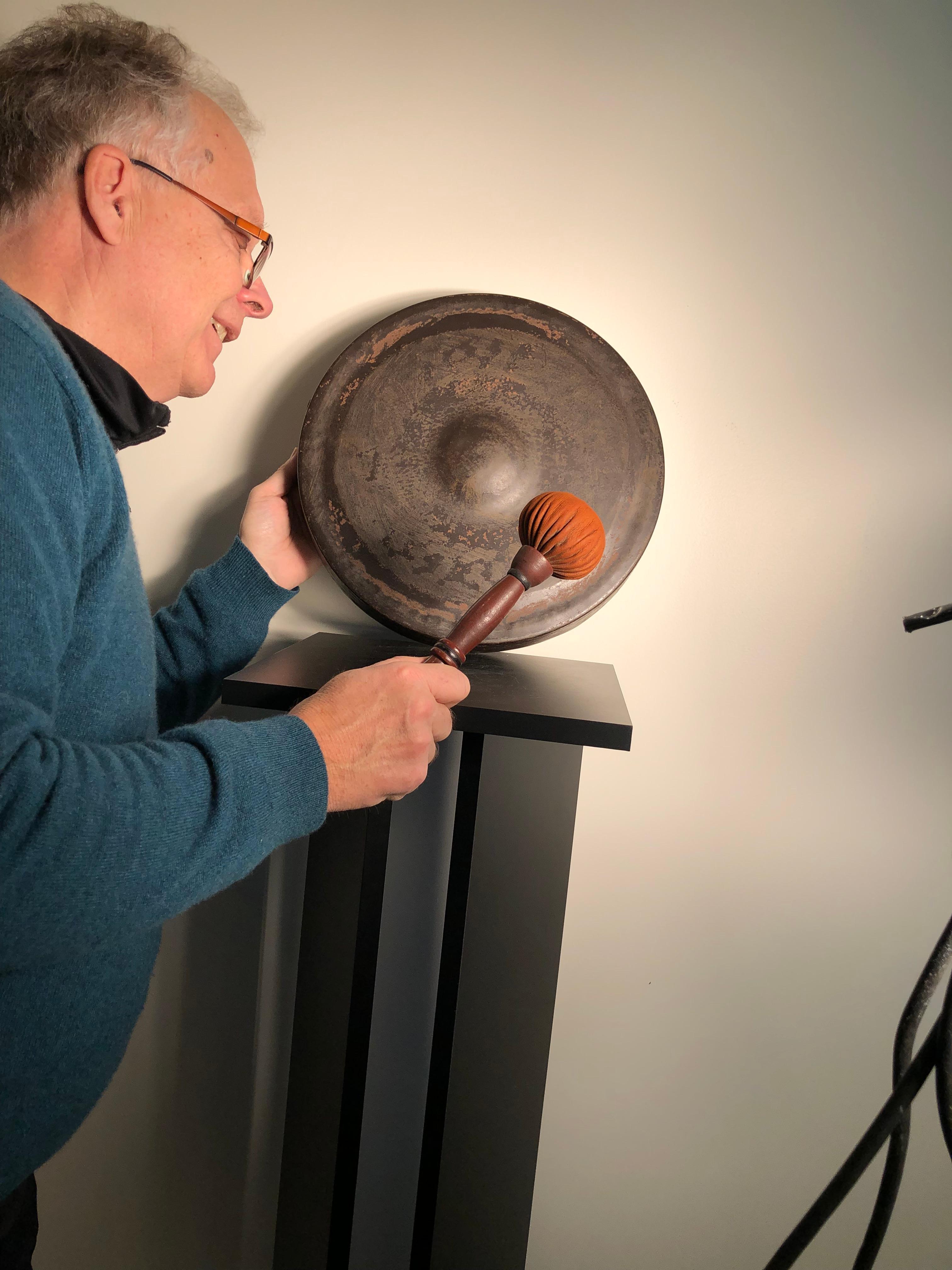 Here's a very nice large scale early 20th century bronze garden temple gong with striker which we just found in an old Kyoto collection.

Dimensions: substantial 14.5 inches diameter. Two inches thick and comes complete with an old striker. And