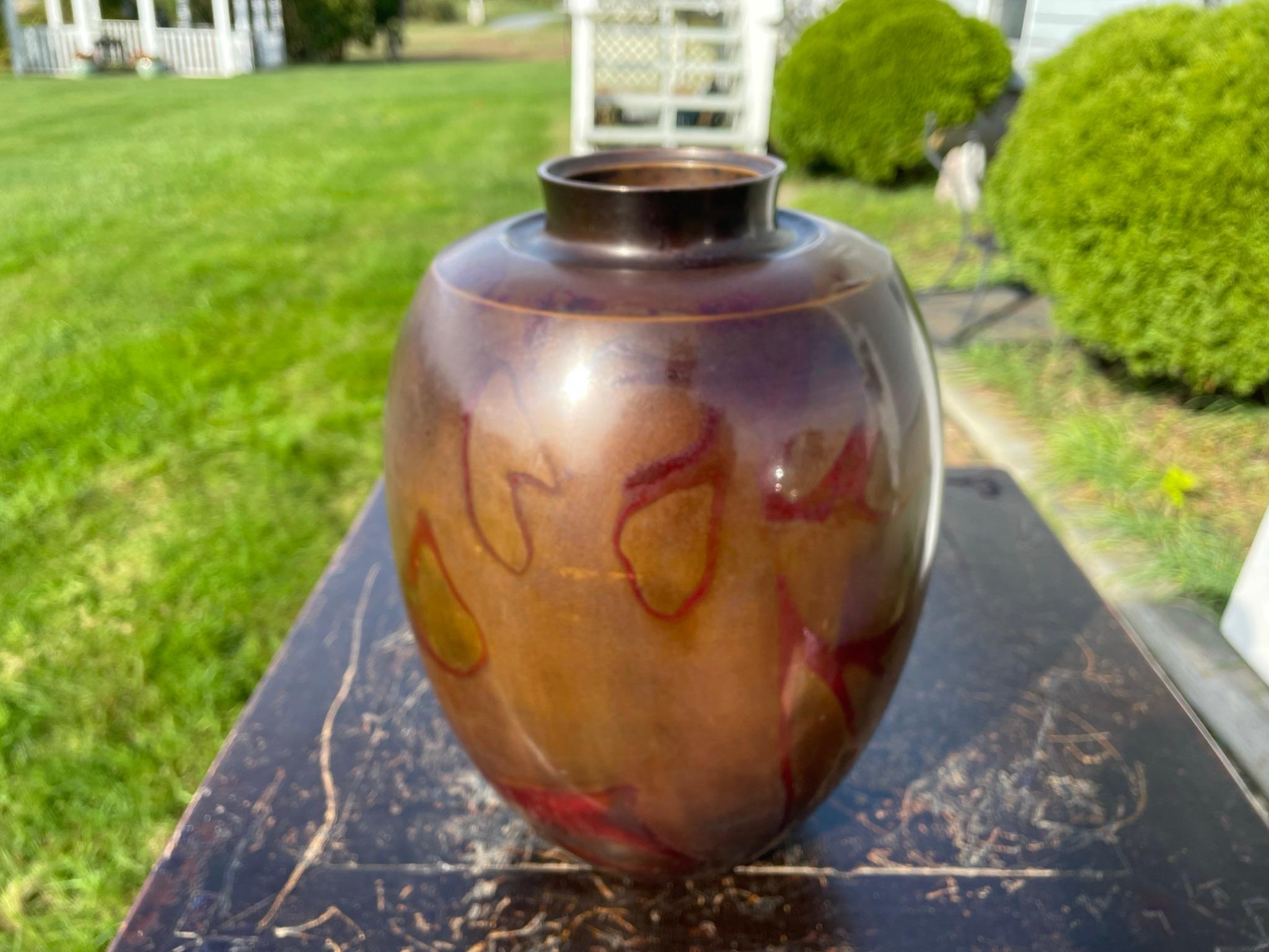 From our recent Japanese Acquisitions

From Japan comes this beautiful large heavily hand cast bronze vase with a special brilliant blazing red 