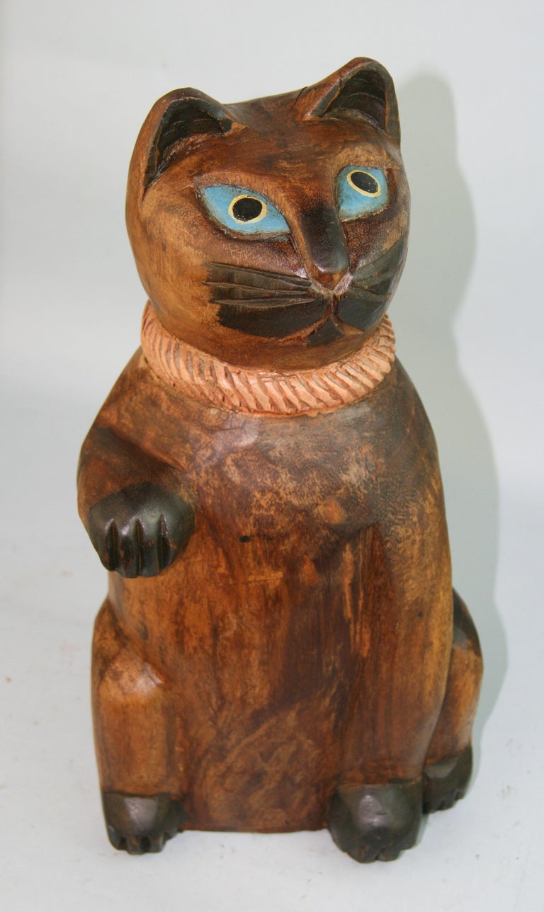 Japan a rare large hand carved and painted wooden Maneki Neiko good fortune money cat. Carved from a solid block of wood (lttobori) style.