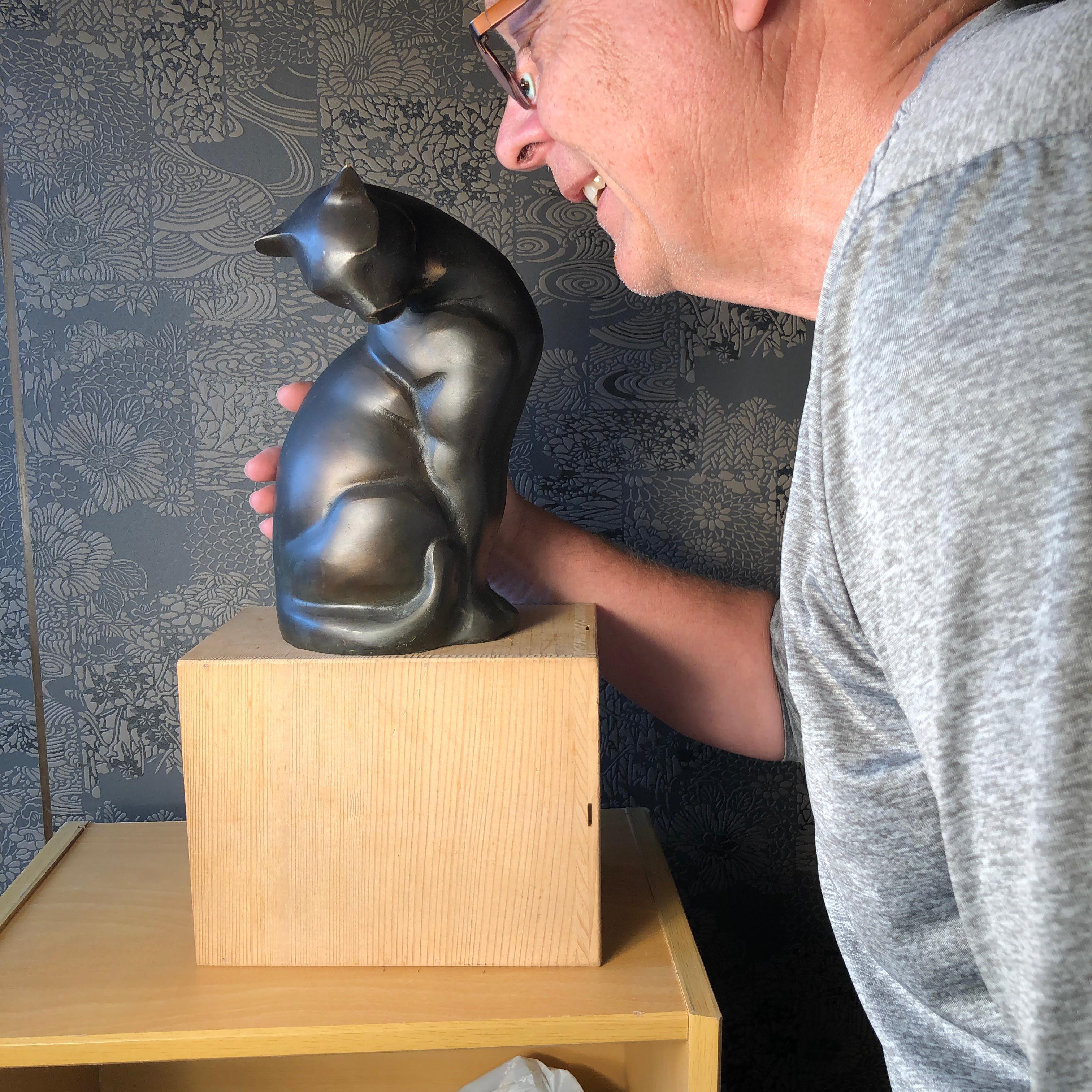 From our recent Japanese Kyoto acquisitions

A fine Japanese tall cast bronze sensuous cat beautifully handcrafted in an attractive Art Deco style. Superb and heavy casting. Sublime motion.

In Japan, there are also cats described as Maneki