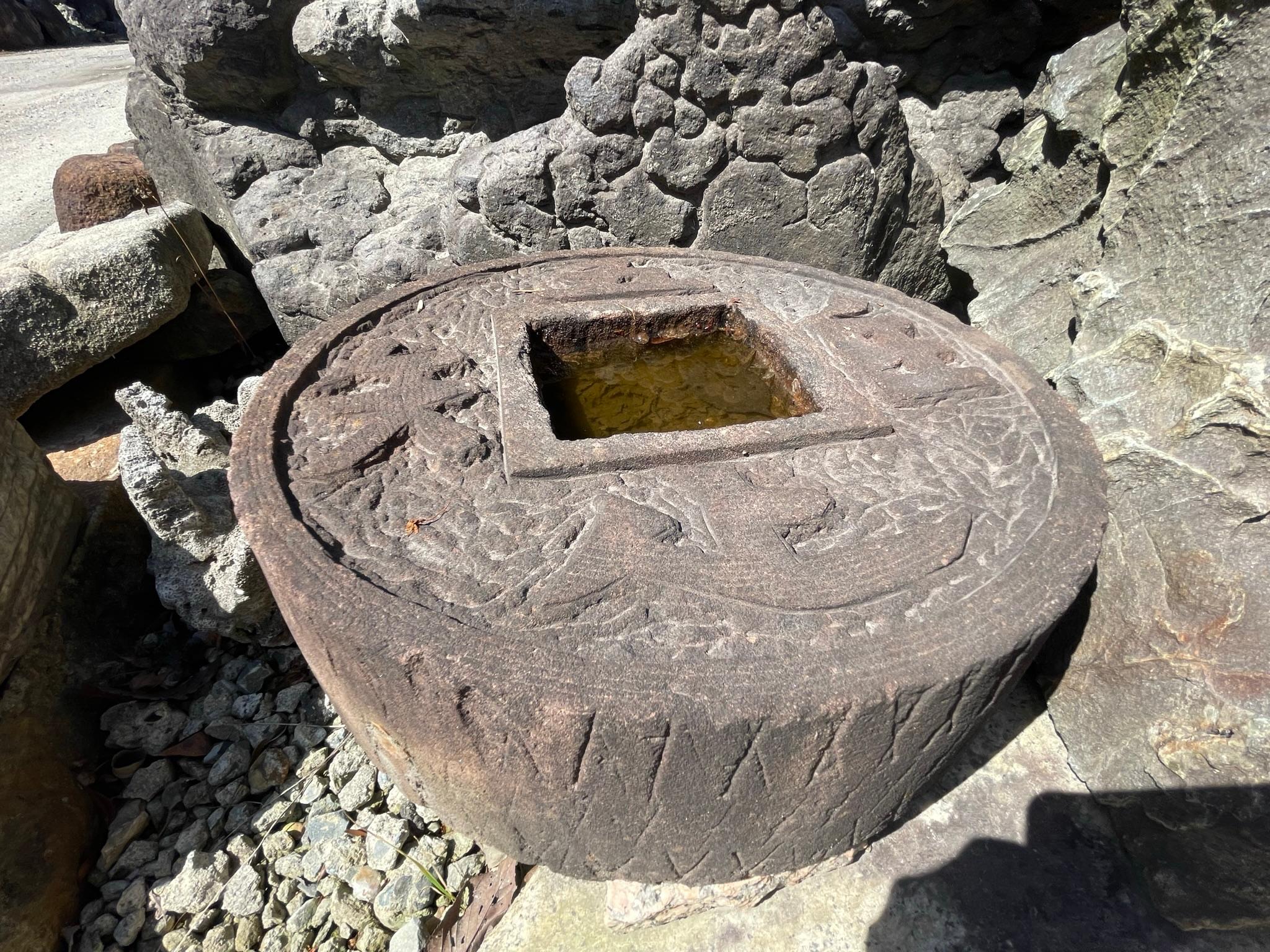 Unusual Controversial shape

Japan, a handsome and unique older round stone water basin tsukubai or planter in the form of Japanese coin with good luck and prosperity kanji inscribed on its top. It was sourced from a decades old Japanese