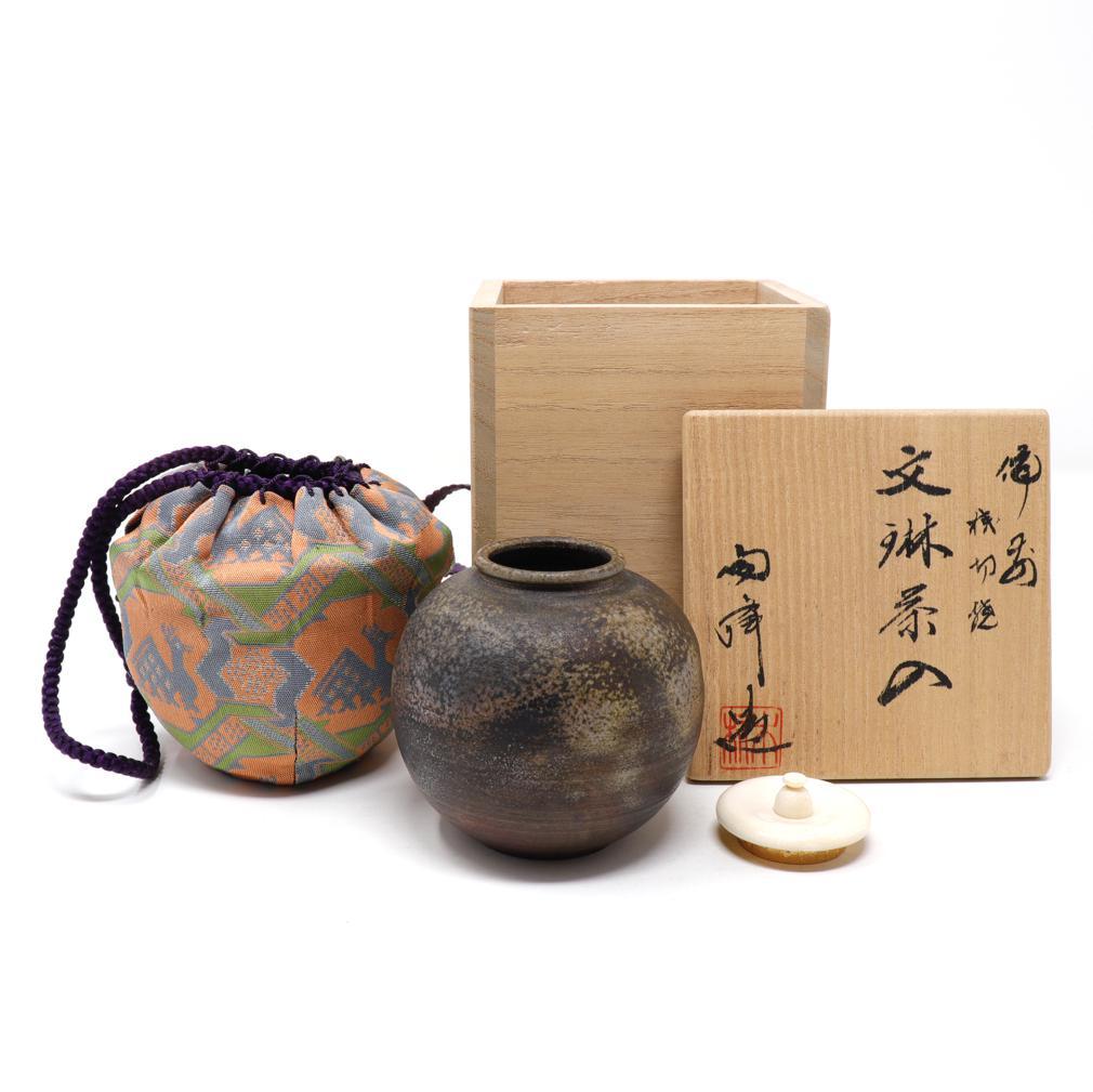 Japanese Bizen ware bunrin chaire by Toho Kimura.
 A ceramic powdered tea container for the Japanese tea ceremony. The globular body delicately potted and mottled with ash adhesions, signed Toho above the string cut base, organic lid with gold leaf