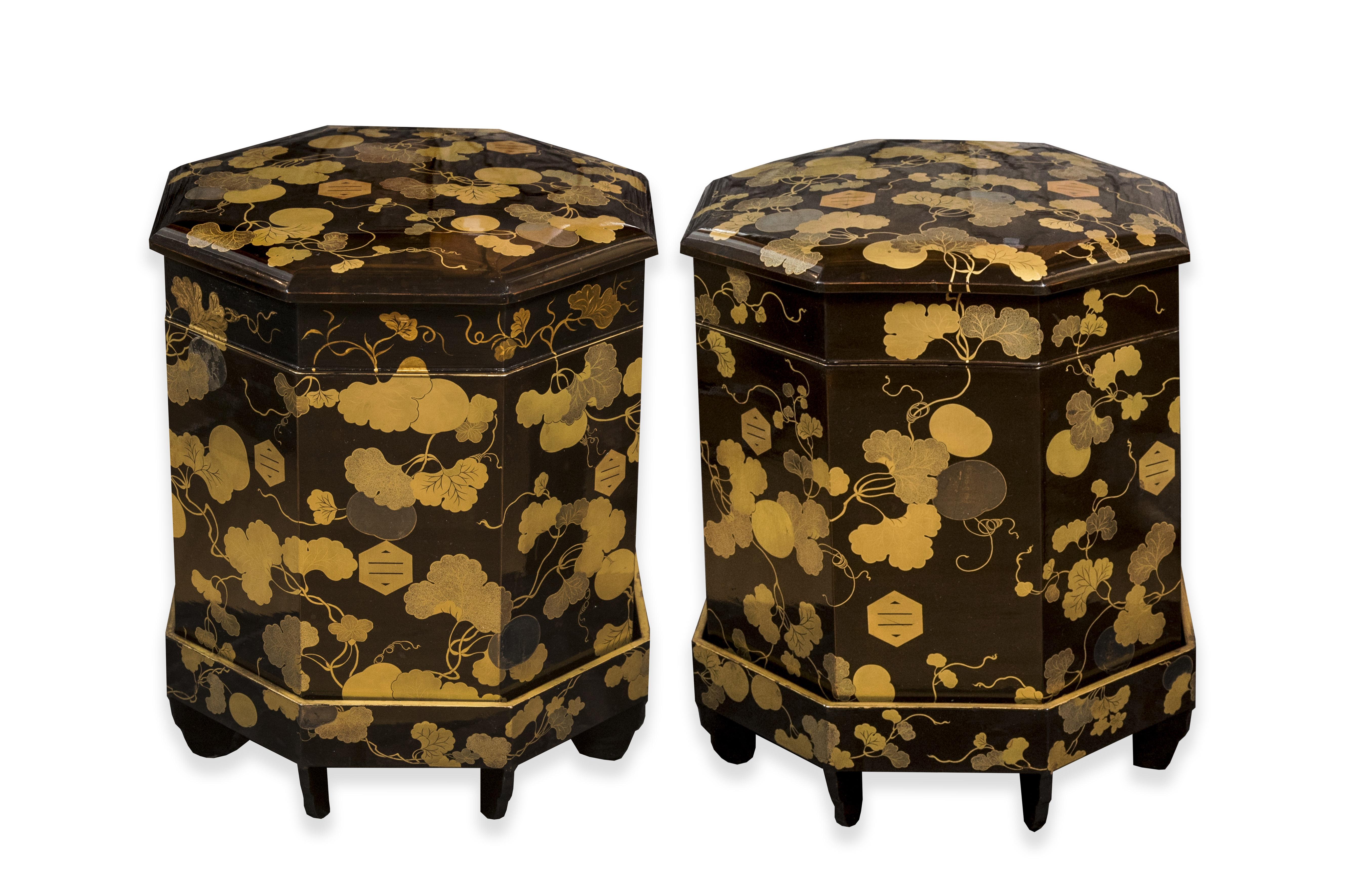 Two big eight-sided kaioke boxes in black lacquer, decorated with mon and maple leaves in golden lacquer. 

These are usually octagonal boxes containing the painted shells used in the game of kai awase (shell association). These boxes contain two