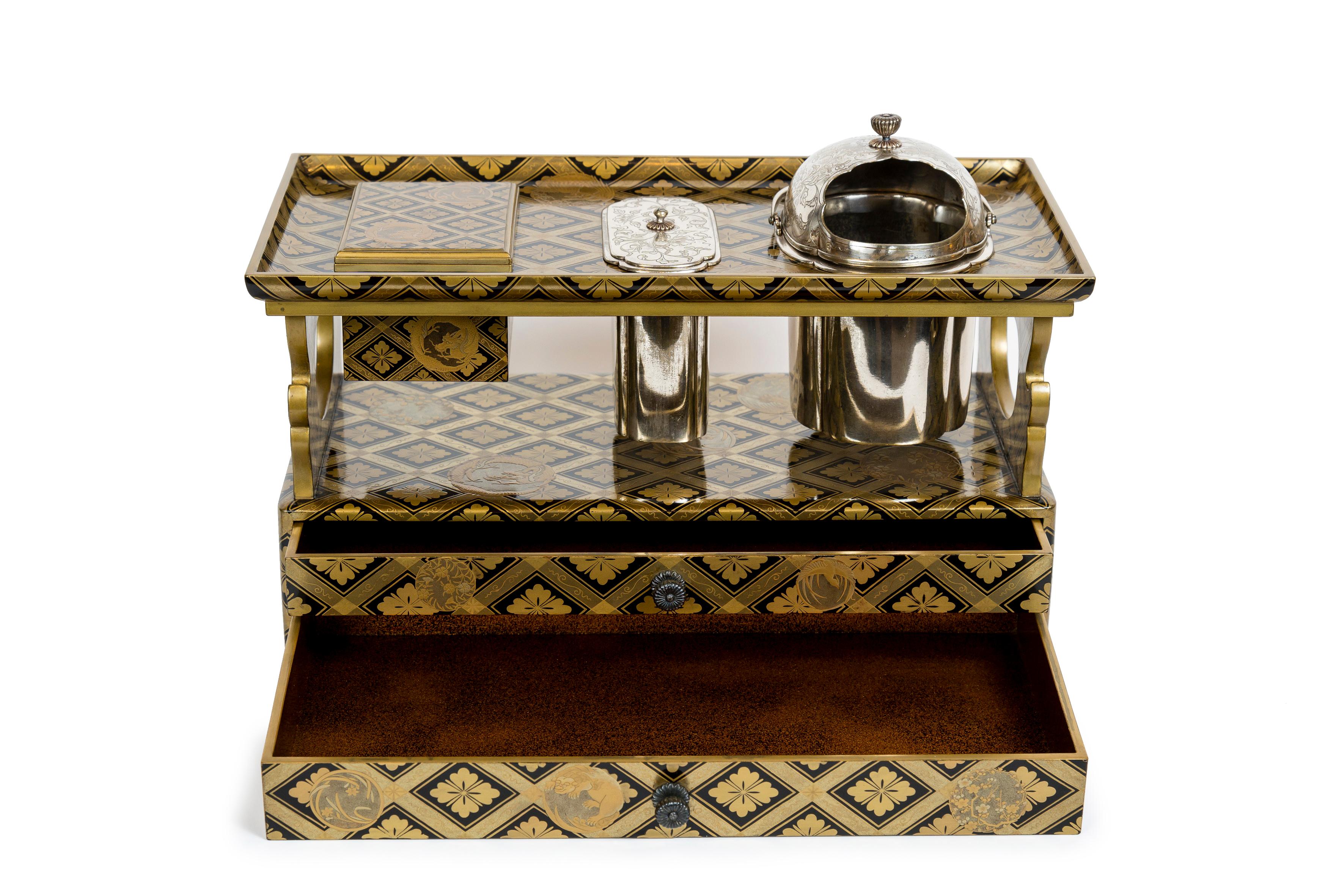 Carved Japanese black and gold lacquer tabako bon or smoking set with silvered bronze