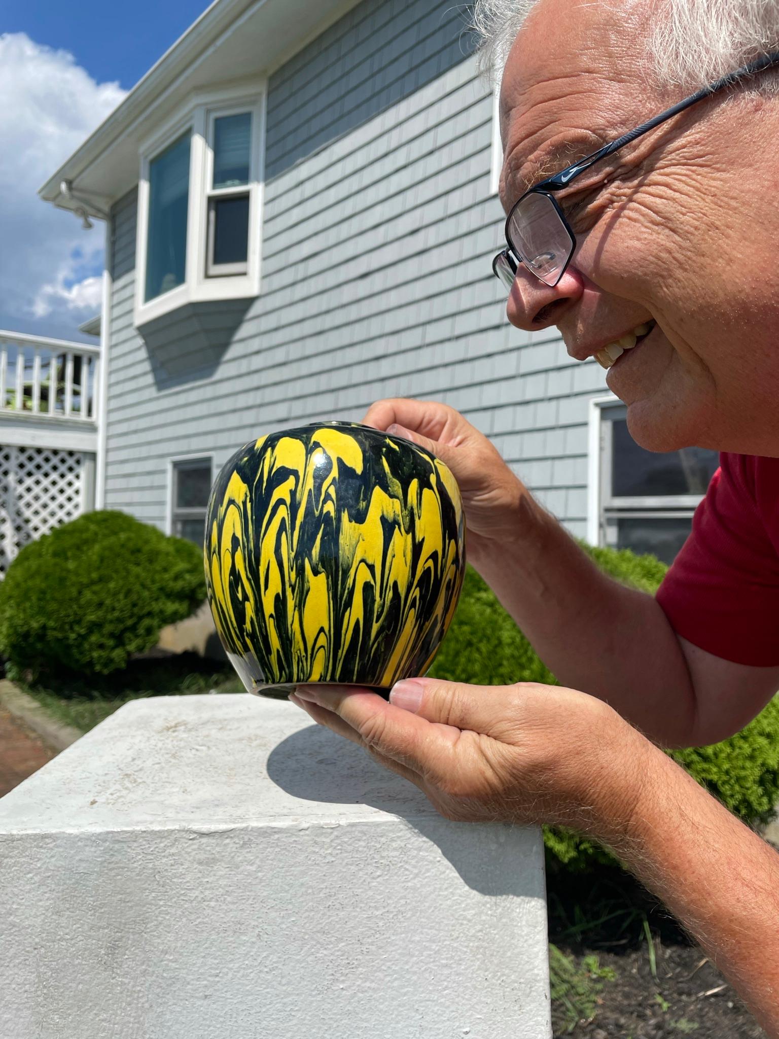 Glazed in a rare and dazzling combination black and yellow marbleized drip glaze 

Japan, a fine and unusual antique marbleized black and yellow drip glazed vase with 