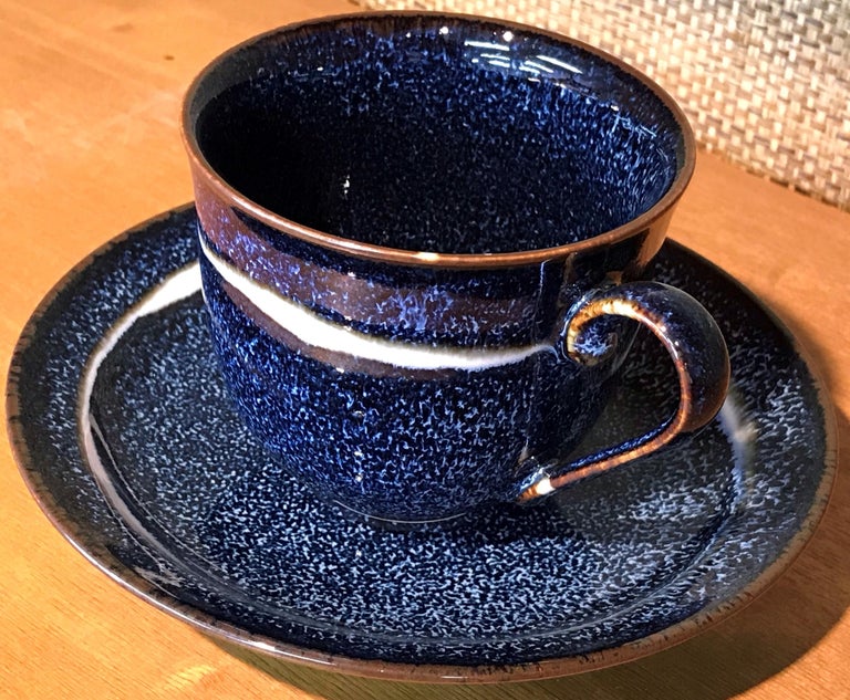Exceptional Japanese contemporary porcelain cup and saucer, hand-glazed in a stunning sparkling blue on black, on a beautifully shaped body. This is a signed work by a highly acclaimed award-winning master porcelain artist from the Imari-Arita