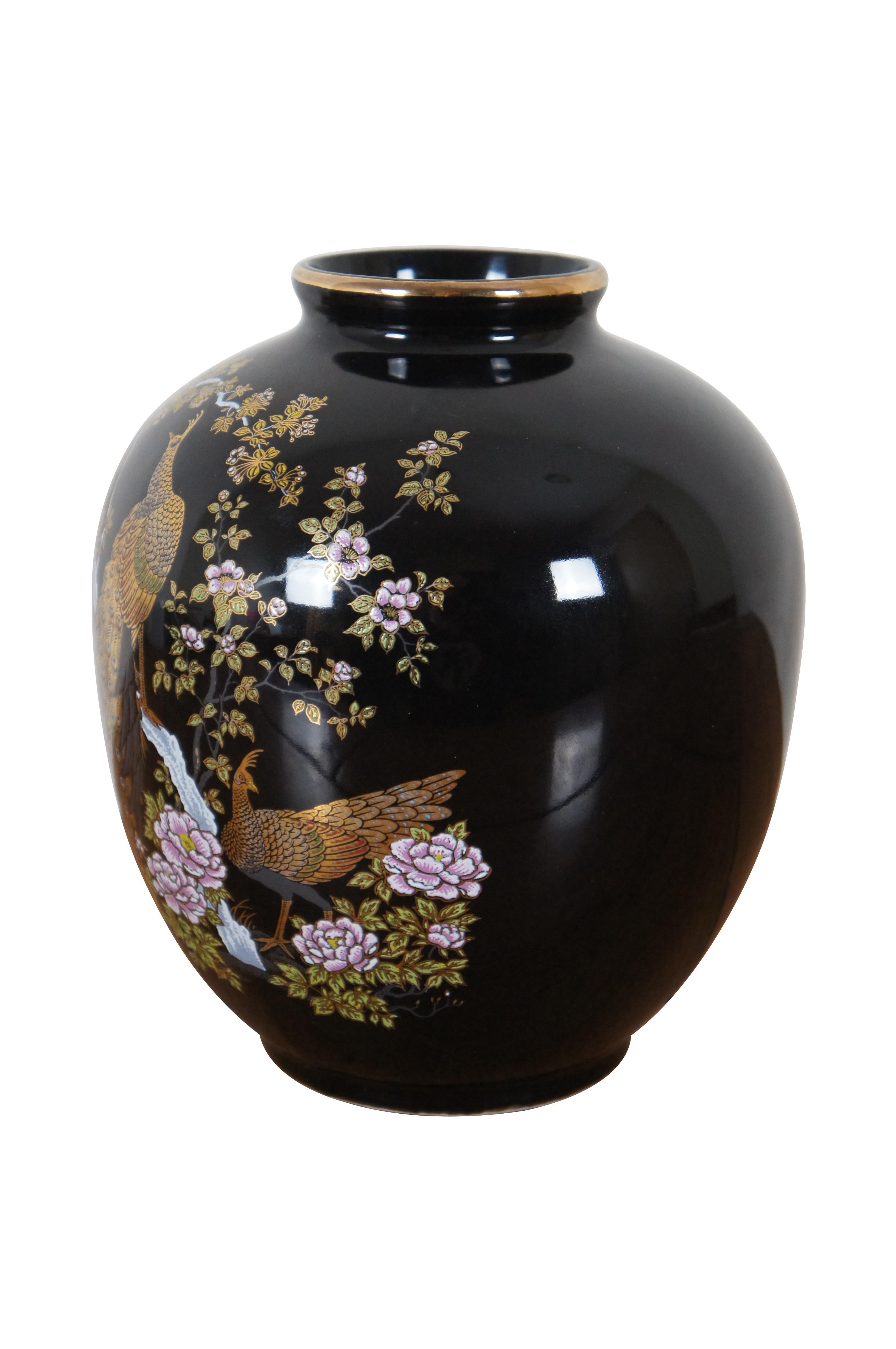 Vintage black porcelain Satsuma vase or urn featuring peacocks and cherry blossom trees.  Made in Japan.

Dimensions:
6.5” x 7.5” (Diameter x Height)