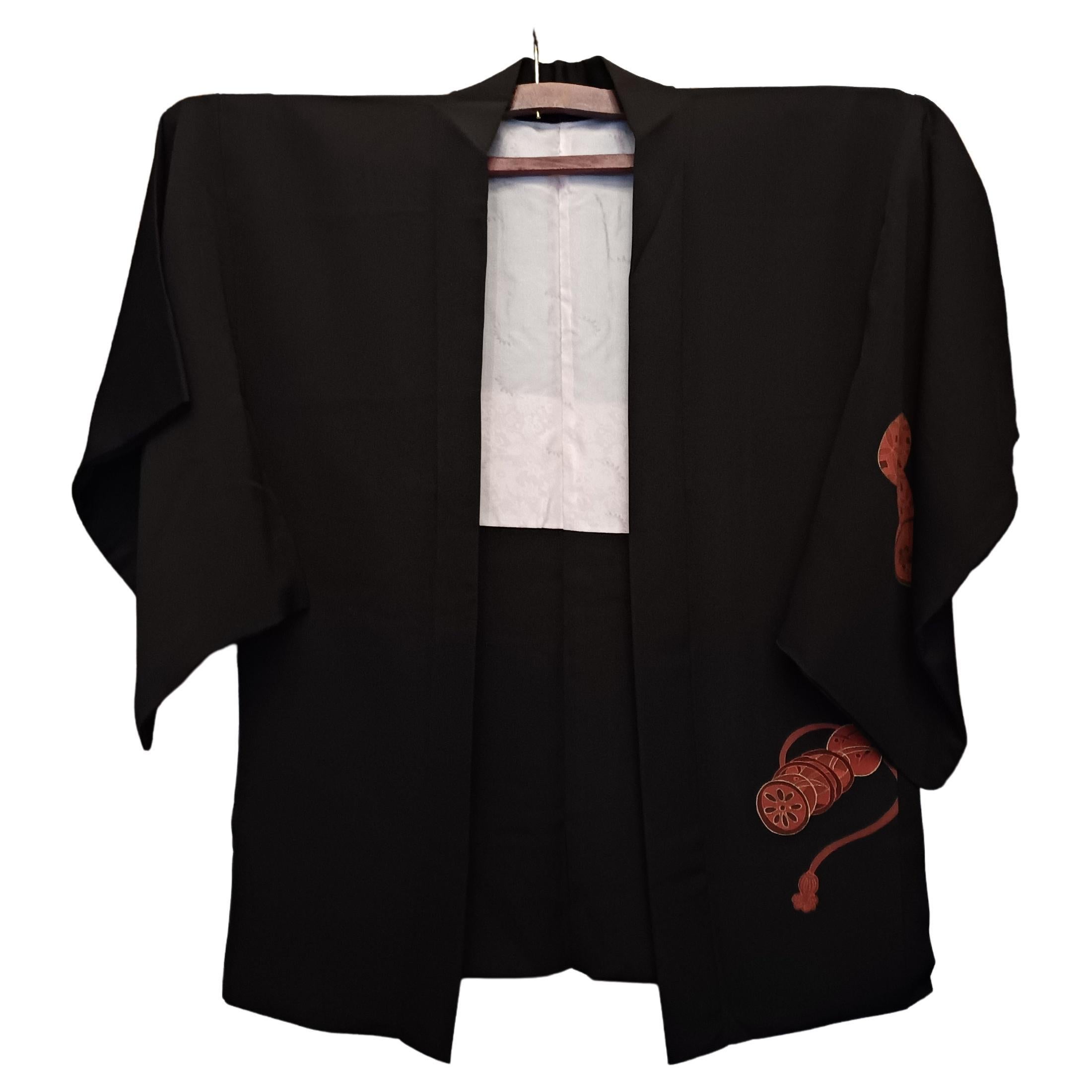 This is a silk jacket which was made in Japan.
It was made in Showa era around 1970s.

The haori is a traditional Japanese hip- or thigh-length jacket worn over a kimono. Resembling a shortened kimono with no overlapping front panels (okumi), the