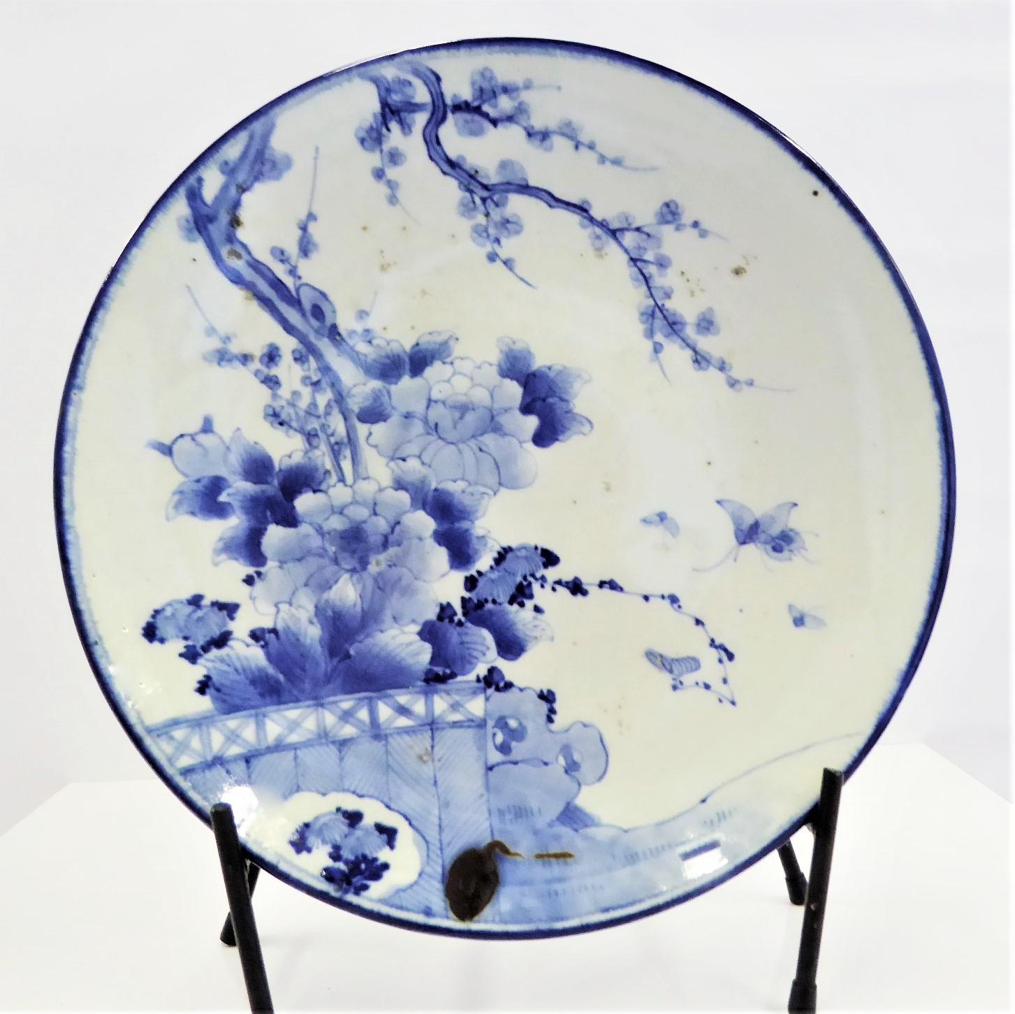 REDUCED FROM $650.....Large and lovely Japanese blue and white Arita porcelain charger from the early 20th century. The symbolism of this Charger is very spiritual. It is decorated with Cherry Blossoms (Sakura), meaning time of renewal but also