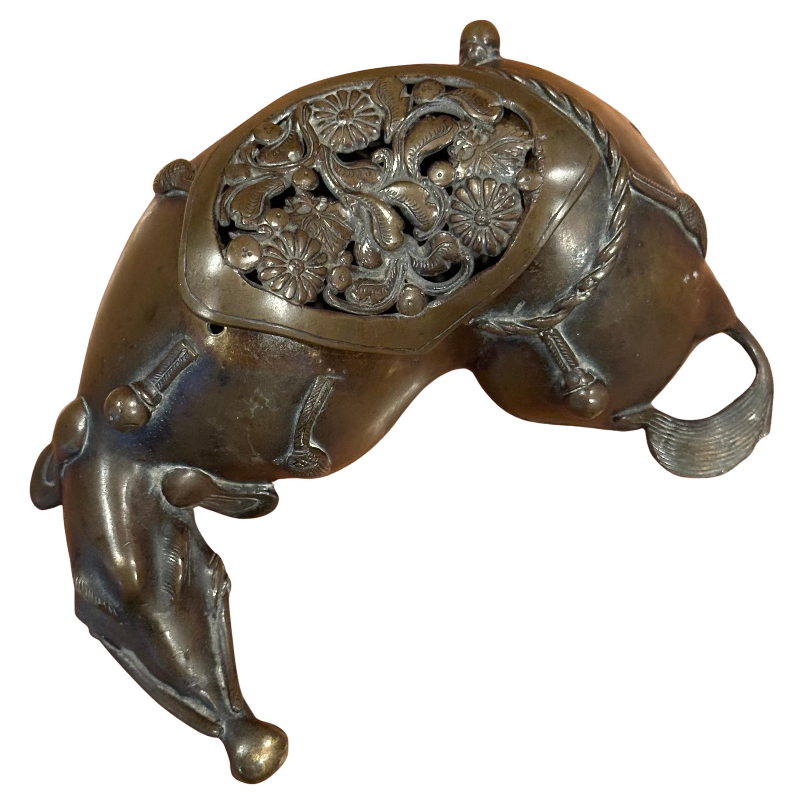 Japanese bronze animal / ox incense burner, circa 1950s.  The piece is in very good vintage condition with a nice patina and measures 6