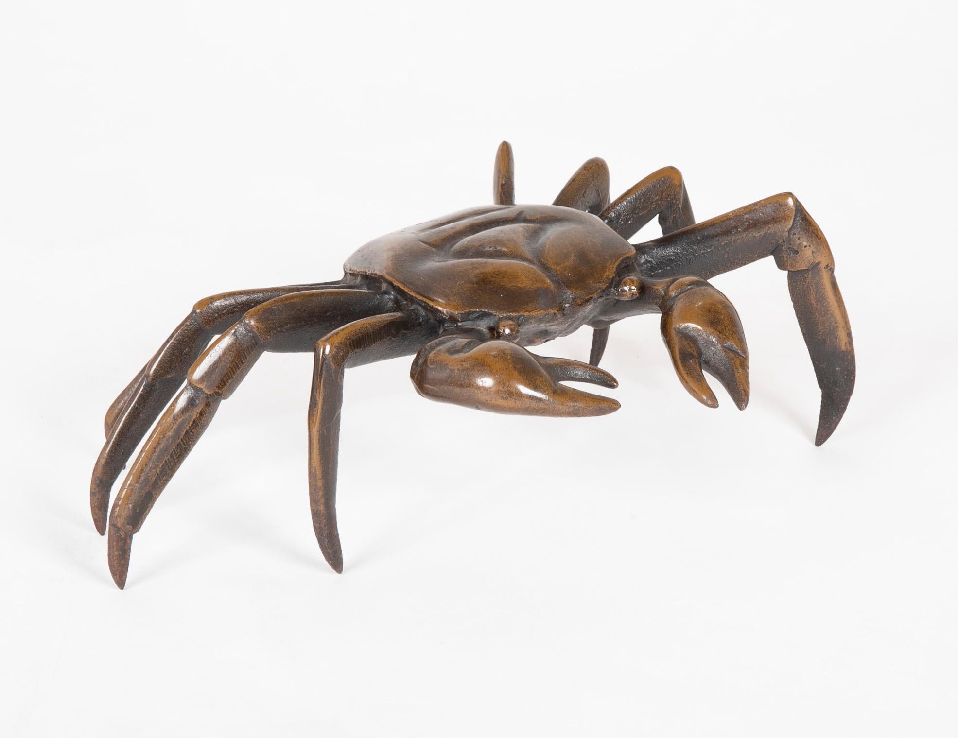 A realistic cast bronze crab with a deep honey gold patina. Nice scale at almost 12 inches wide. Japanese, late 19th or early 20th century.