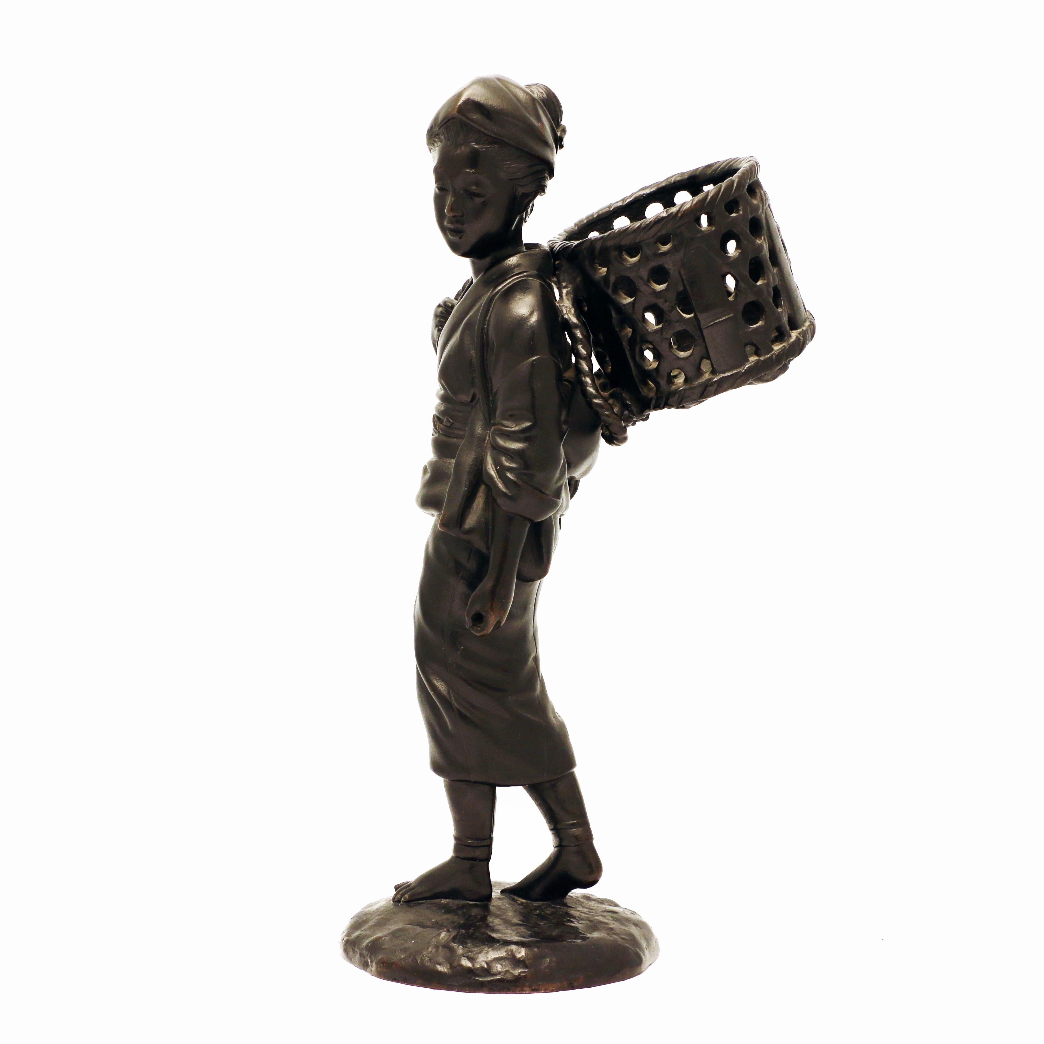 Sympathetically modelled, she looks to her left while turning, her right hand holds the cord supporting the basket. She is shown in mid-stride. The sculptor has caught well the sense of motion. It is signed on the base.