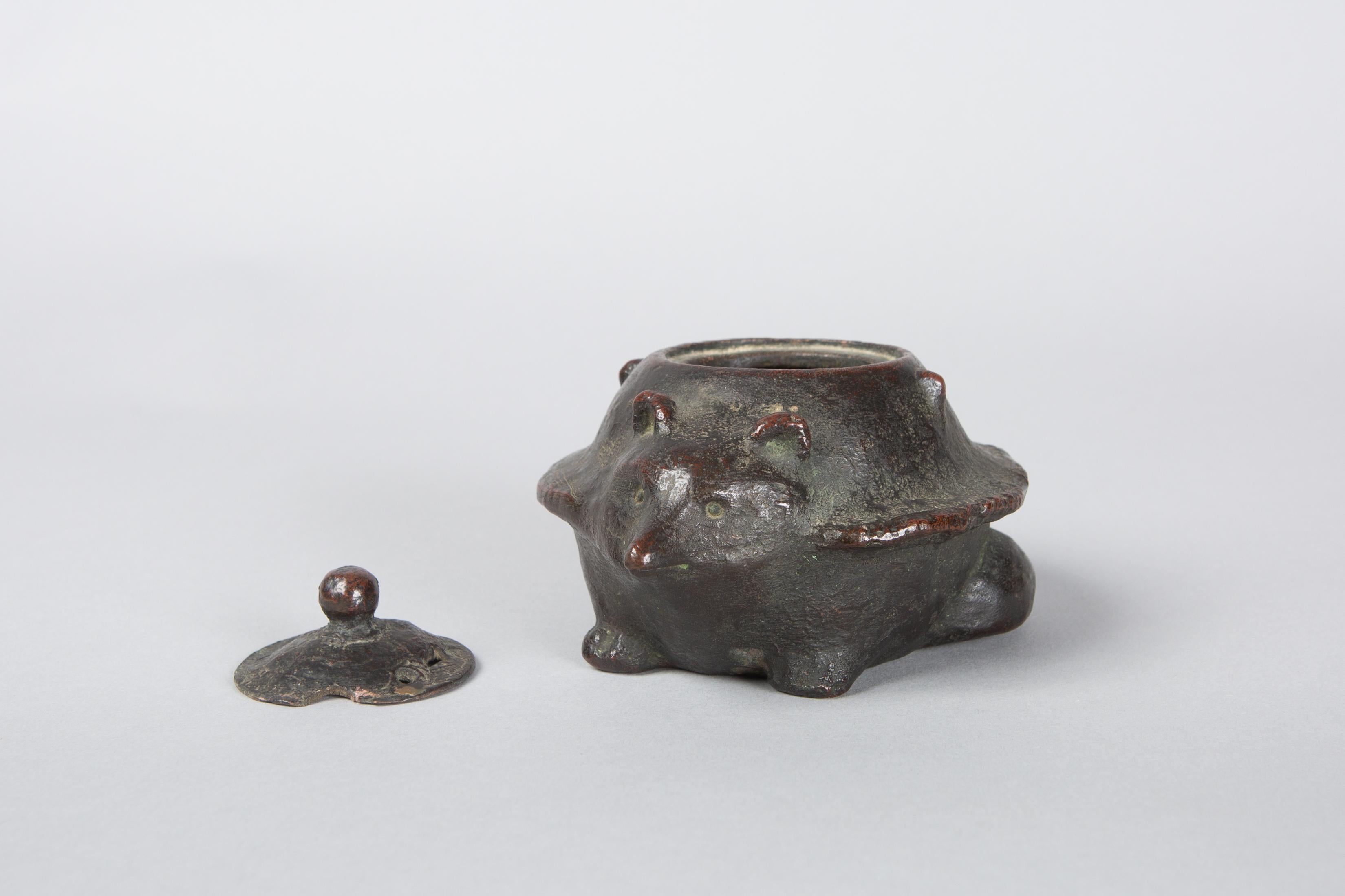 Japanese bronze Koro (Incense Burner) in the form of a Badger, Edo Period (circa 1800) bronze incense burner with removable top. Badger face and tail details, and wonderful patina from many years of use.