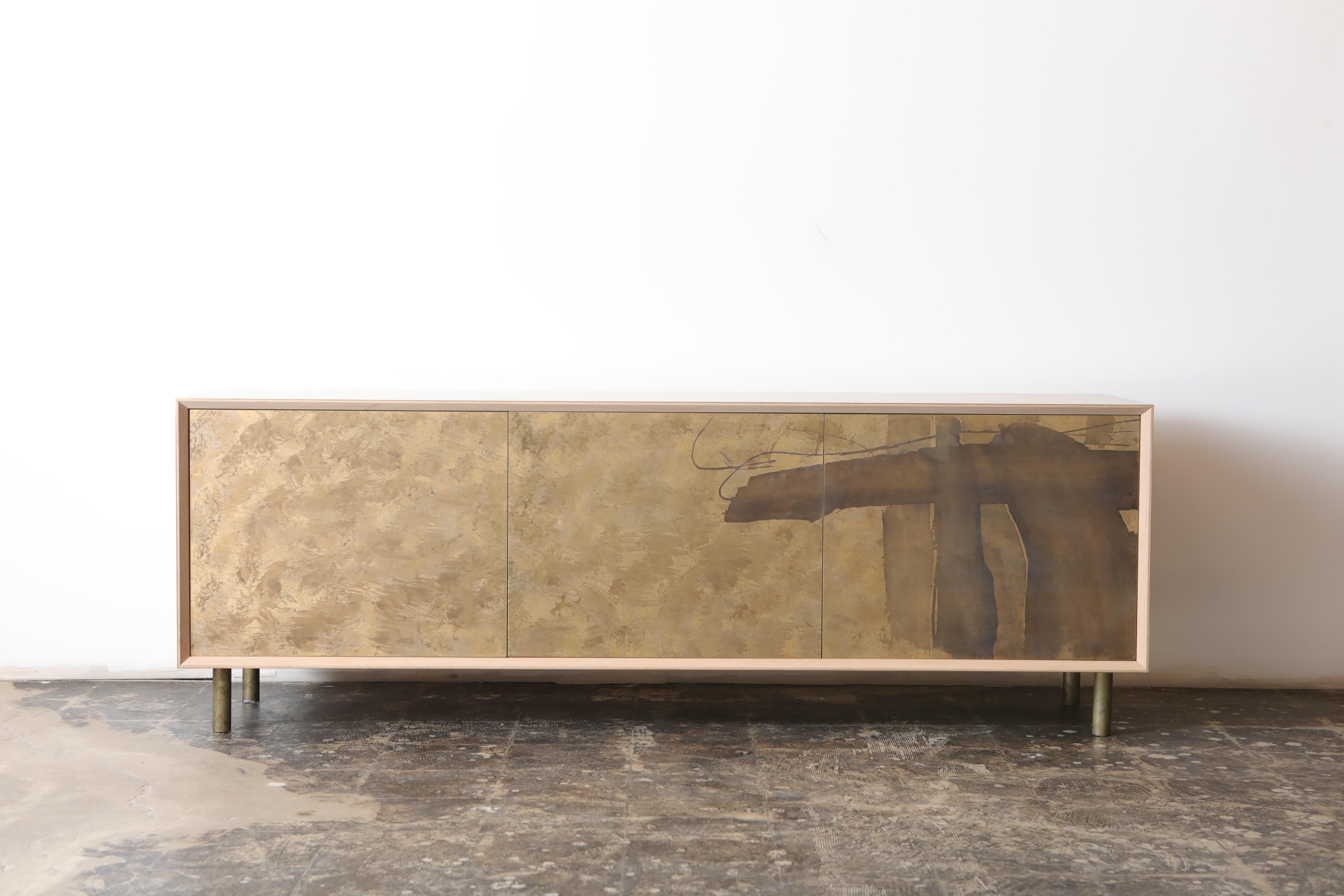The Japanese bronze leaf patinated credenza is created to showcase and store many objects. This unit can be used as a buffet-unit, media unit, sideboard, credenza and acts as an art object in any space. The interior of the unit is made of unfinished