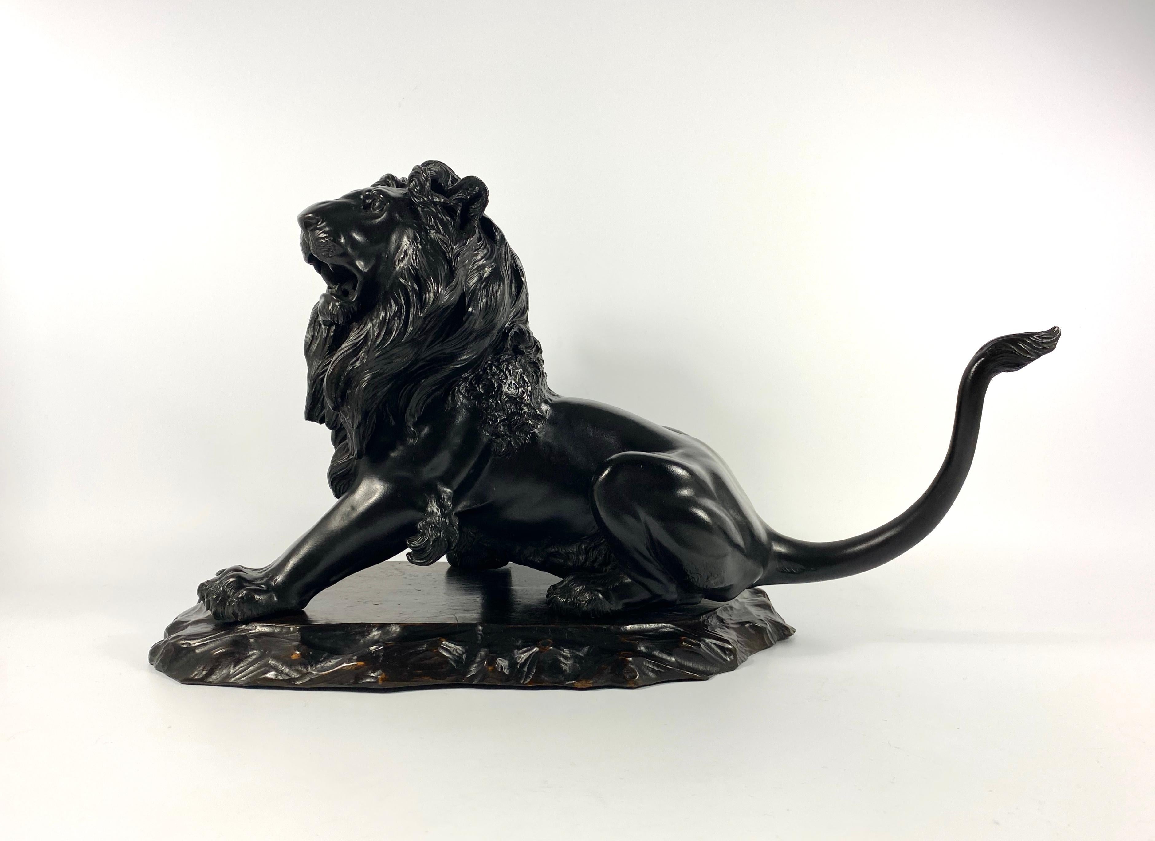 £1,450.00
Japanese bronze okimono, signed Kyoi Masatsune,  Meiji period. Powerfully cast, as a large, seated, roaring lion. It’s mane well delineated, and tail raised.
Set upon an original carved, hardwood base, cut with a notch, to accept the lions