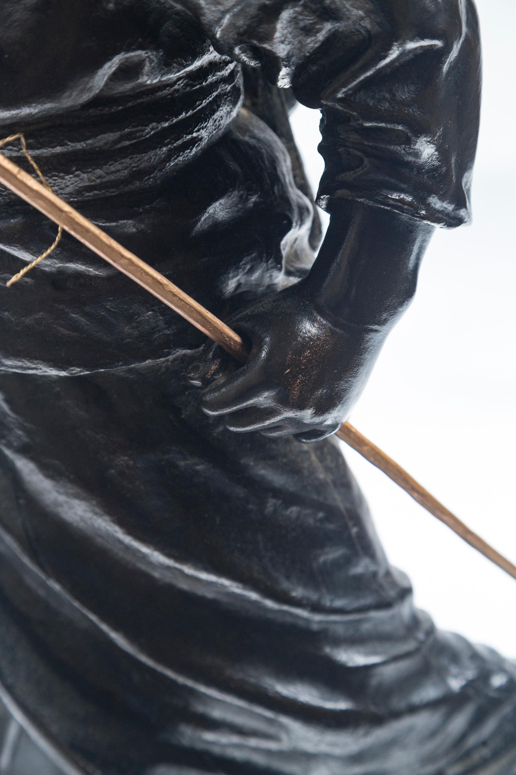 black fishing boy statue