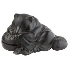 Japanese bronze sculpture depicting a tanuki in shingon buddhist monk clothes