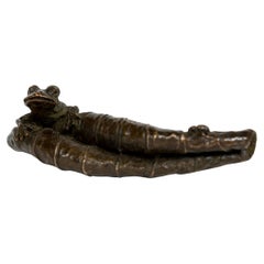 Japanese bronze sculpture of a frog hidding in a lotus leaf (Okimono)