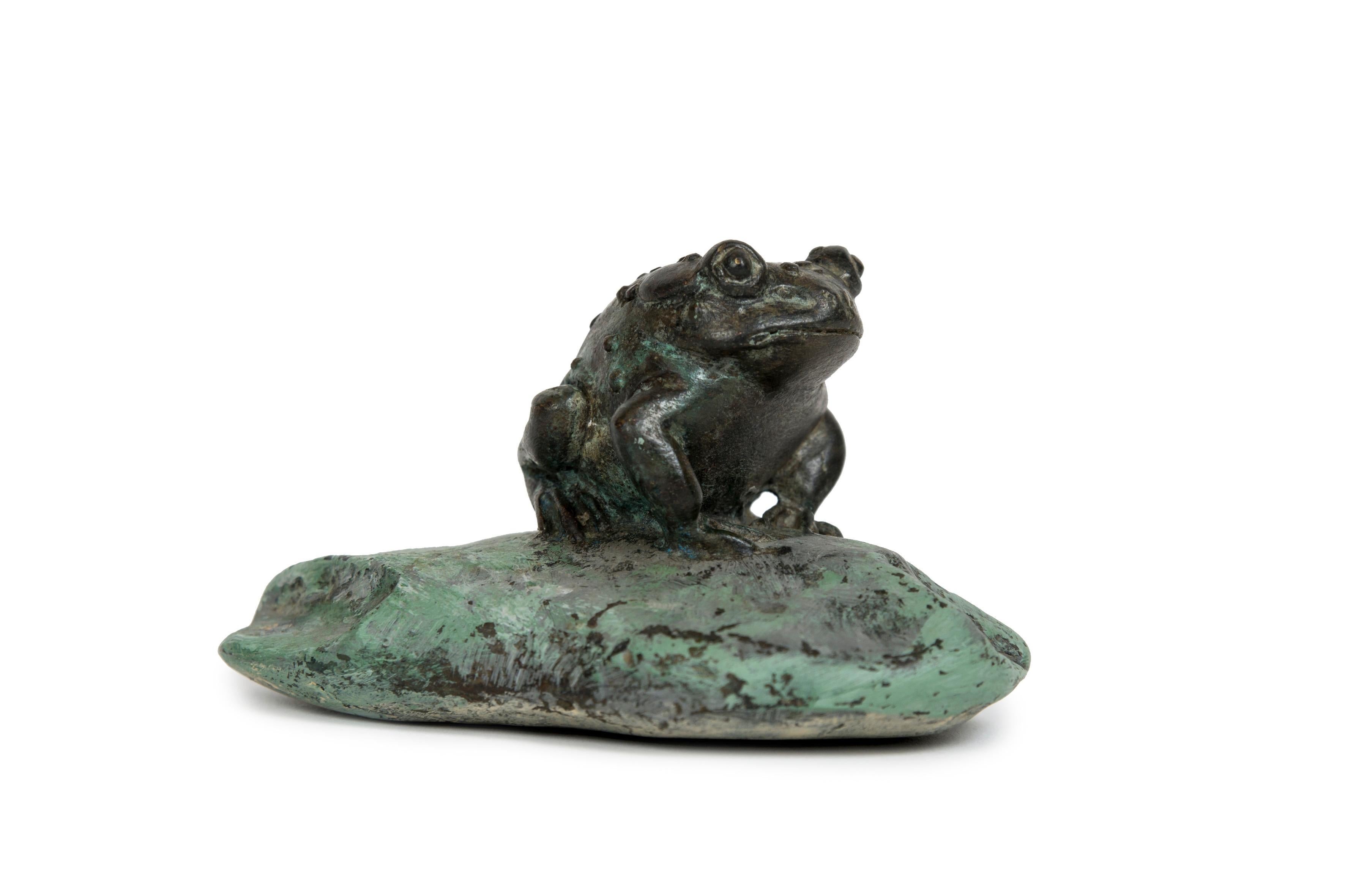 Meiji Japanese bronze sculpture of a grotesque toad seated on a pinted stone
