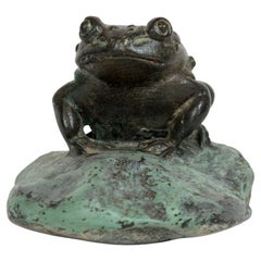 Japanese bronze sculpture of a grotesque toad seated on a pinted stone
