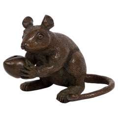 Japanese Bronze sculpture of a standing Mouse holding an Hazelnut