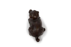 Japanese Bronze sculpture representing a puppy lying down