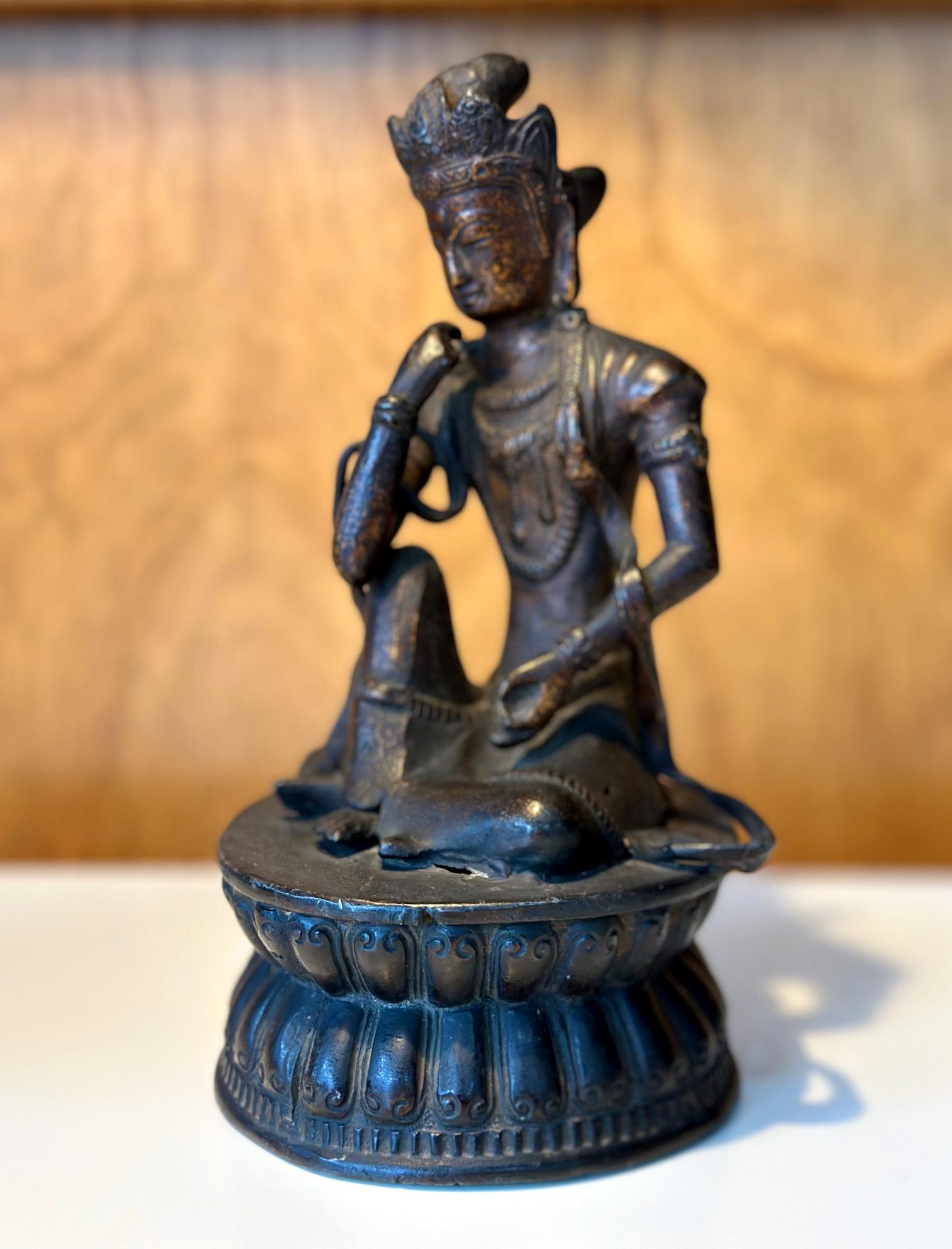 A small and fine Japanese bronze statue of Nyoirin Kannon circa 18th century of Edo period. Kannon is bodhisattva of Mercy and Compassion (Avalokitesvara in Sanskrit and Guanyin in Chinese). The gilt bronze statue depicts one of the six variations