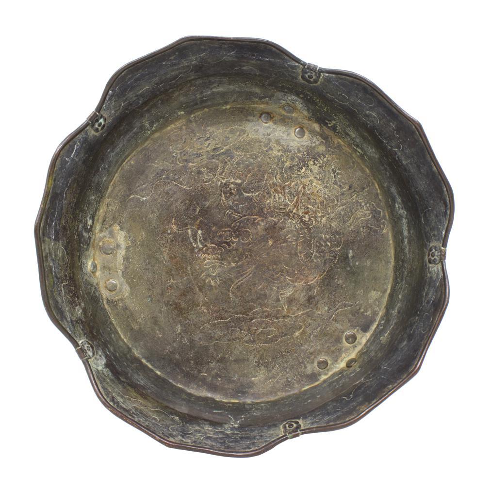 UH80301 Japanese Bronze Tripod Ritual Wash Basin (Ashitsuki-darai), Muromachi Period, 16th century.  
A five petal round form with undulating rolled edge and pinched strap detail with five petal escutcheons. The cavetto is slightly everted. The