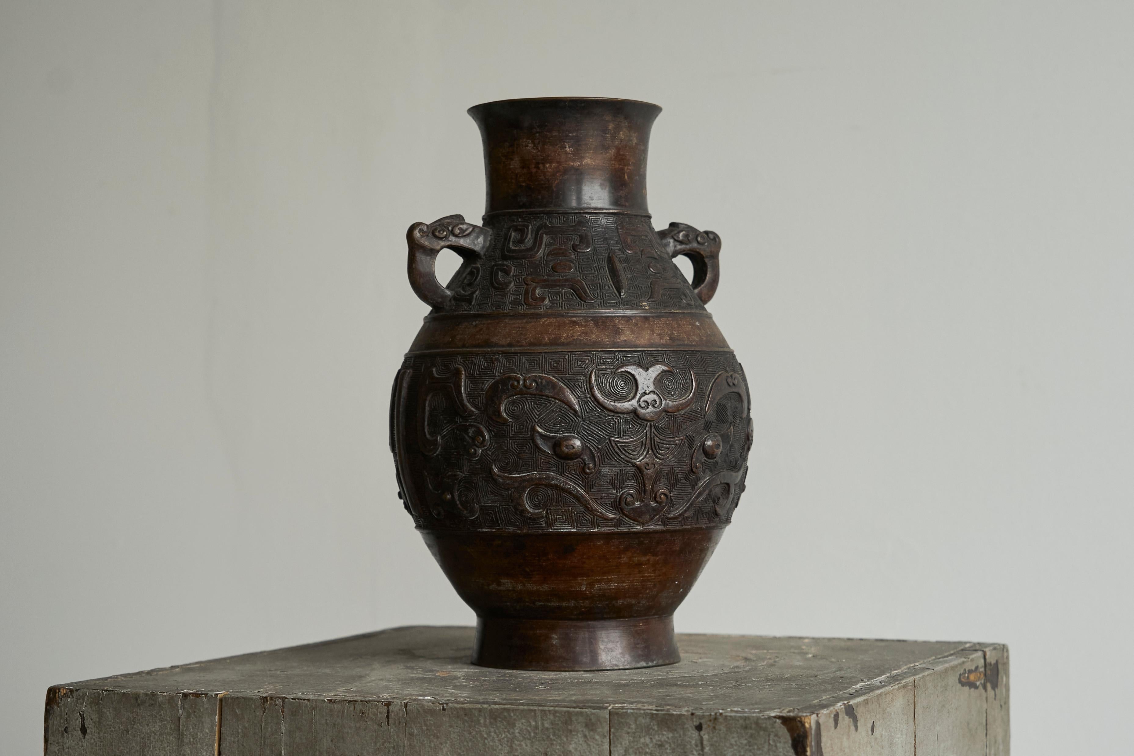 Tall Bronze Vase, Japan, Early 20th Century.

This is a very beautiful eared vase / urn in bronze from Japan. Probably early 20th century.

From a high end estate, acquired through travel. 

Beautiful shape and details - wonderful dark brown / dark