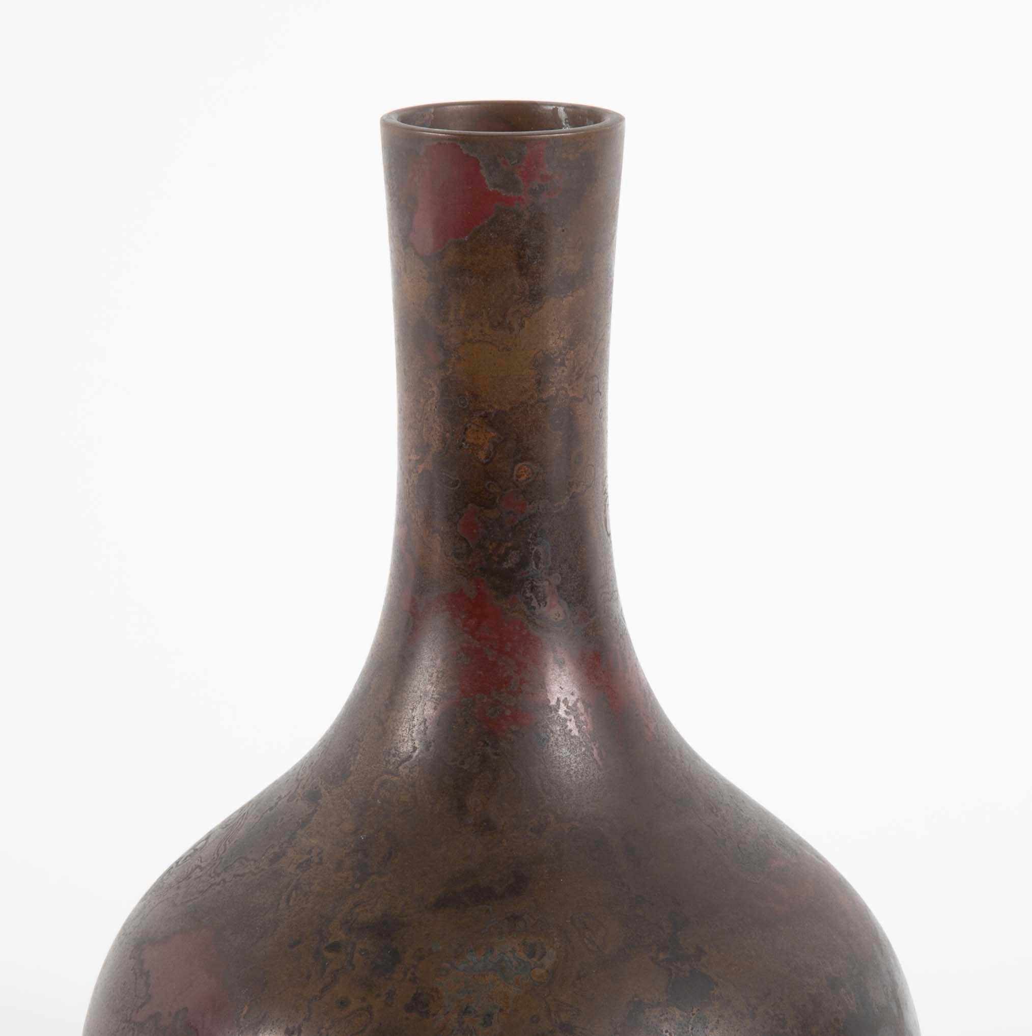 Japanese bronze vase with marbleized patina having bulbous body with elongated neck. Showa period, 20th century.