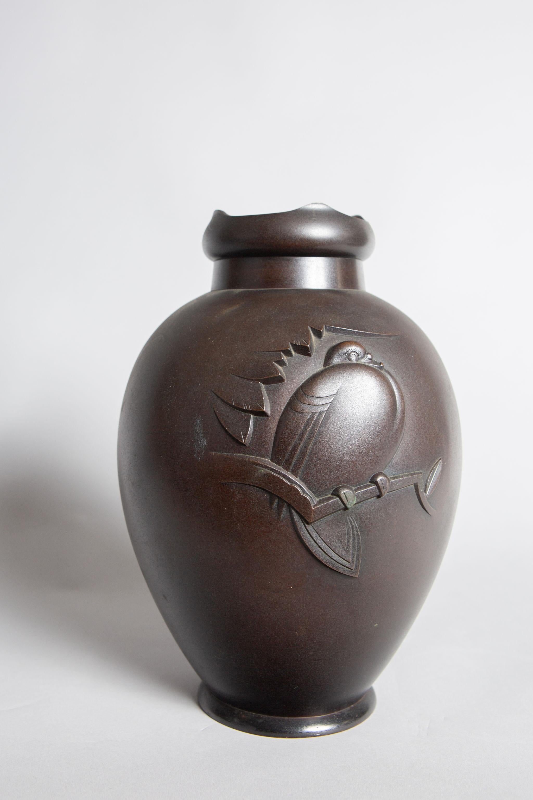 Taisho period vase (1912 - 1926) with abstract, geometric vignette of a pigeon resting on a branch. Interesting crown shaped silouhette on top. Signature reads: Sadatsugu. Has two minor dents, priced accordingly.