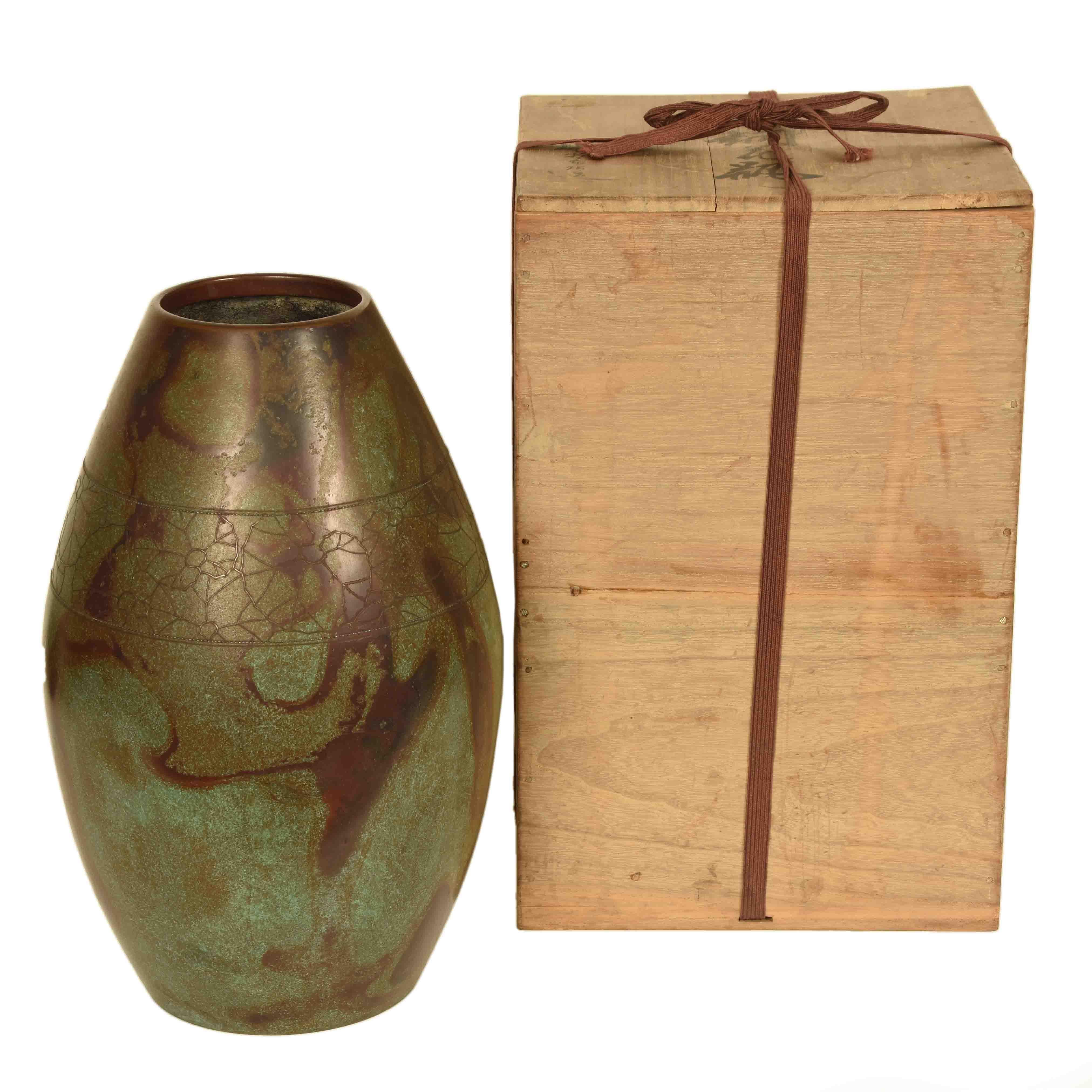 A vintage, Japanese bronze vase from Takaoka. Takaoka is a city on the main island of Honshu. While bronze work originated in China, Japanese artisans have developed an array of techniques in the production of decorative bronzes that have elevated